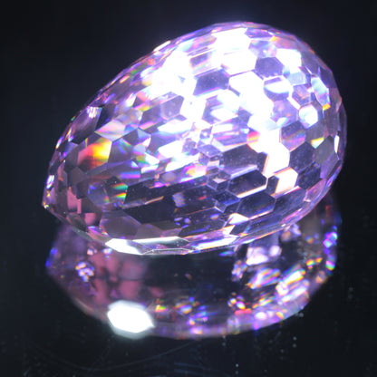 Faceted Nd:YAG Long Egg Gemstone on a black Background