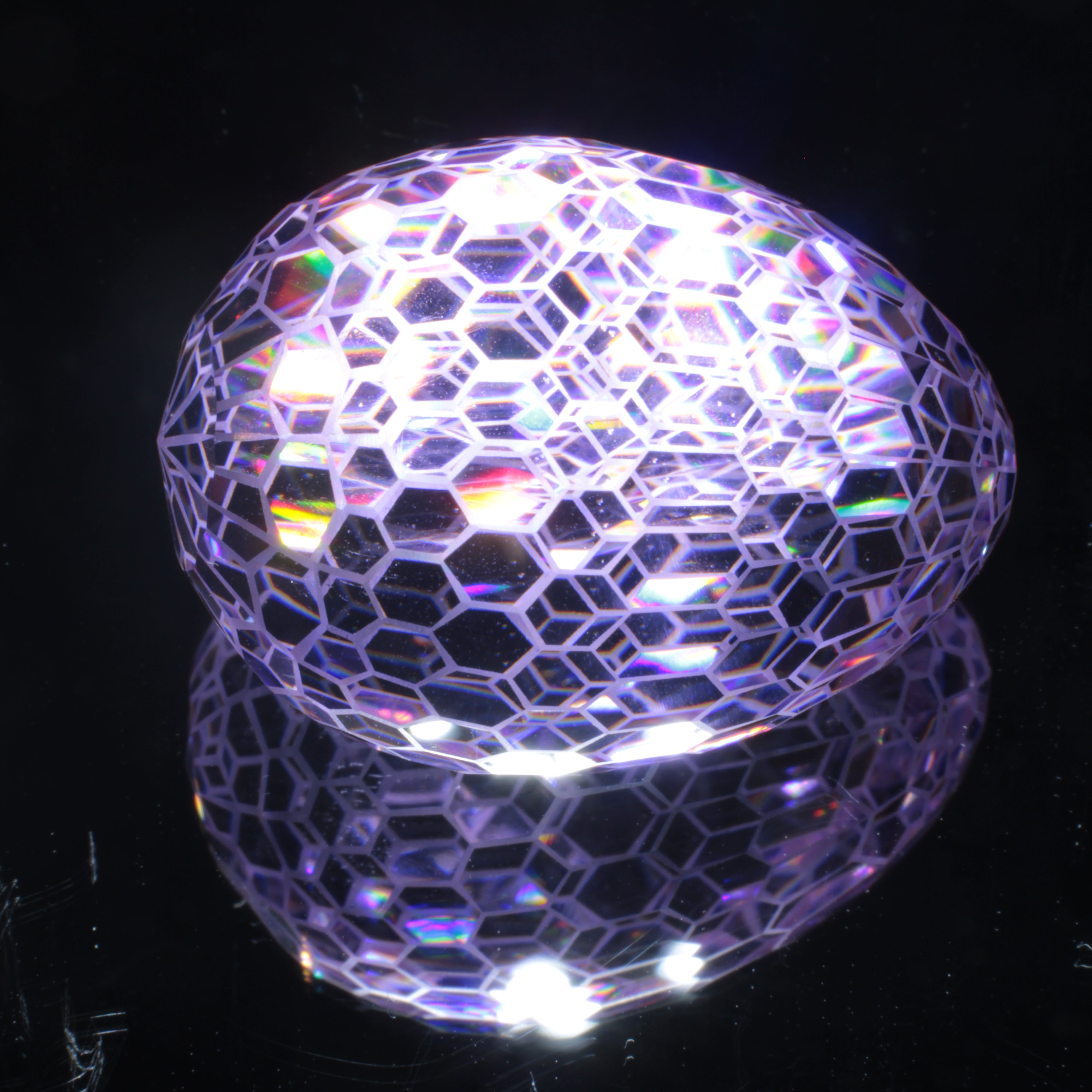Faceted Nd:YAG Large Egg with Frosted Edges Gemstone on a black Background