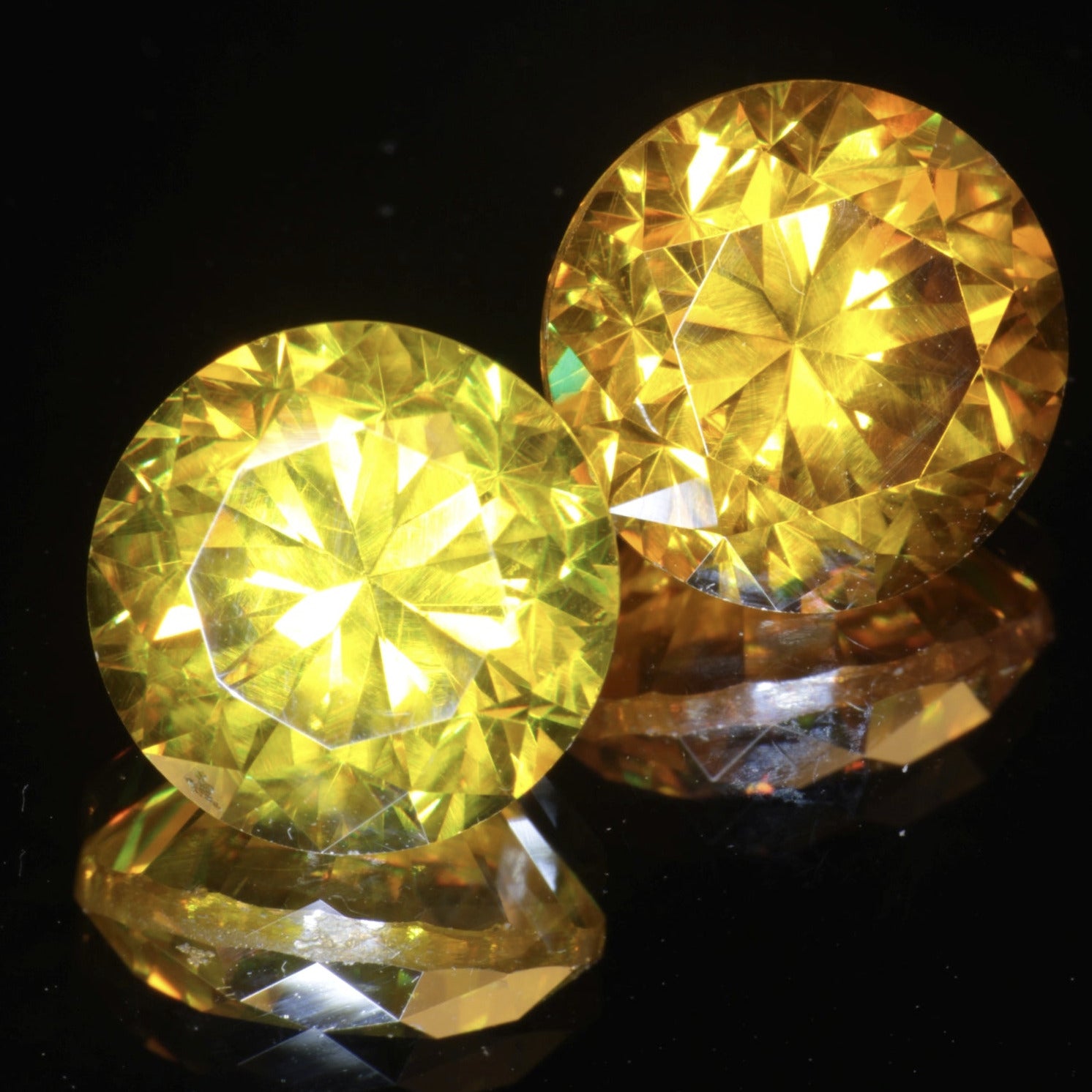 Faceted Pair of BGO-20 gemstones, both yellow and orange