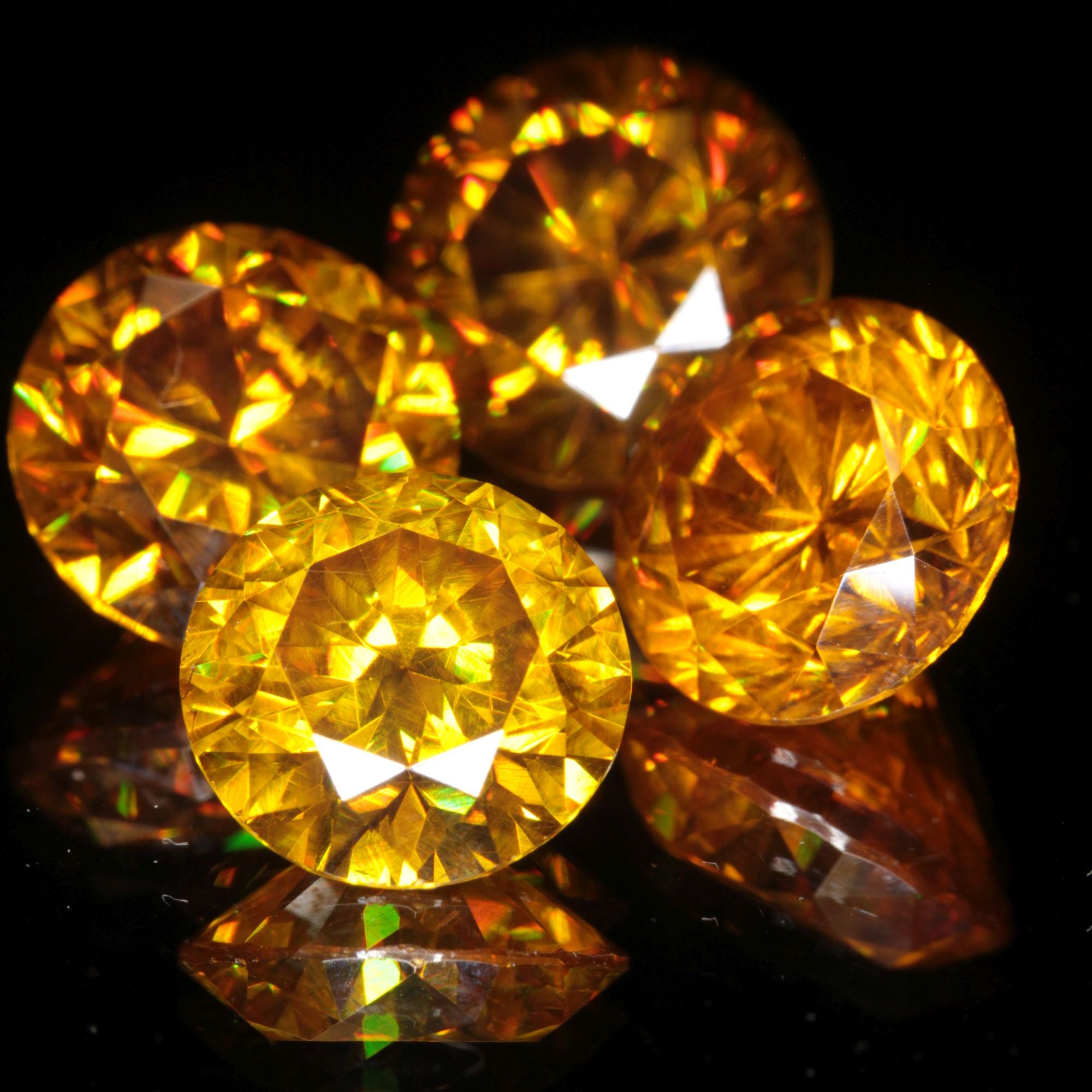 Four orange faceted BGO-20 round gemstones (lab sillenite), 10mm