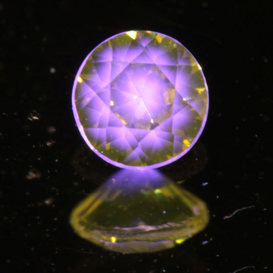 Faceted Round Ce/Nd YAG Gemstone with “Bullseye” Pink Fluorescence in the Yellow Crystal