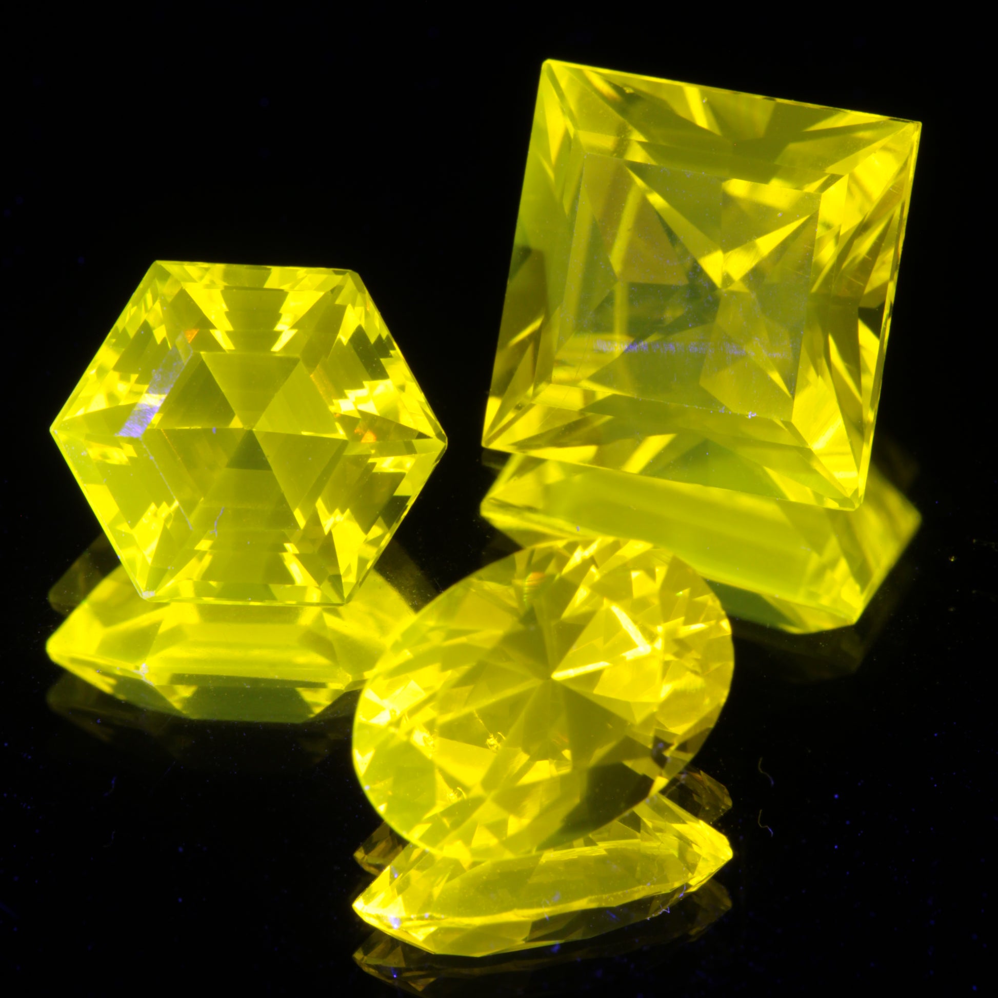 Three Cerium YAG Gemstones under normal light
