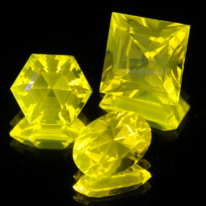 Three Cerium YAG Gemstones under normal light