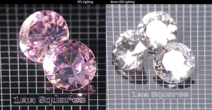 Faceted Er/Nd YAG displayed under two lights, CFL on the left making it pink, warm led on the right making it yellow, demonstrating the colorchange on a  Round gemstone