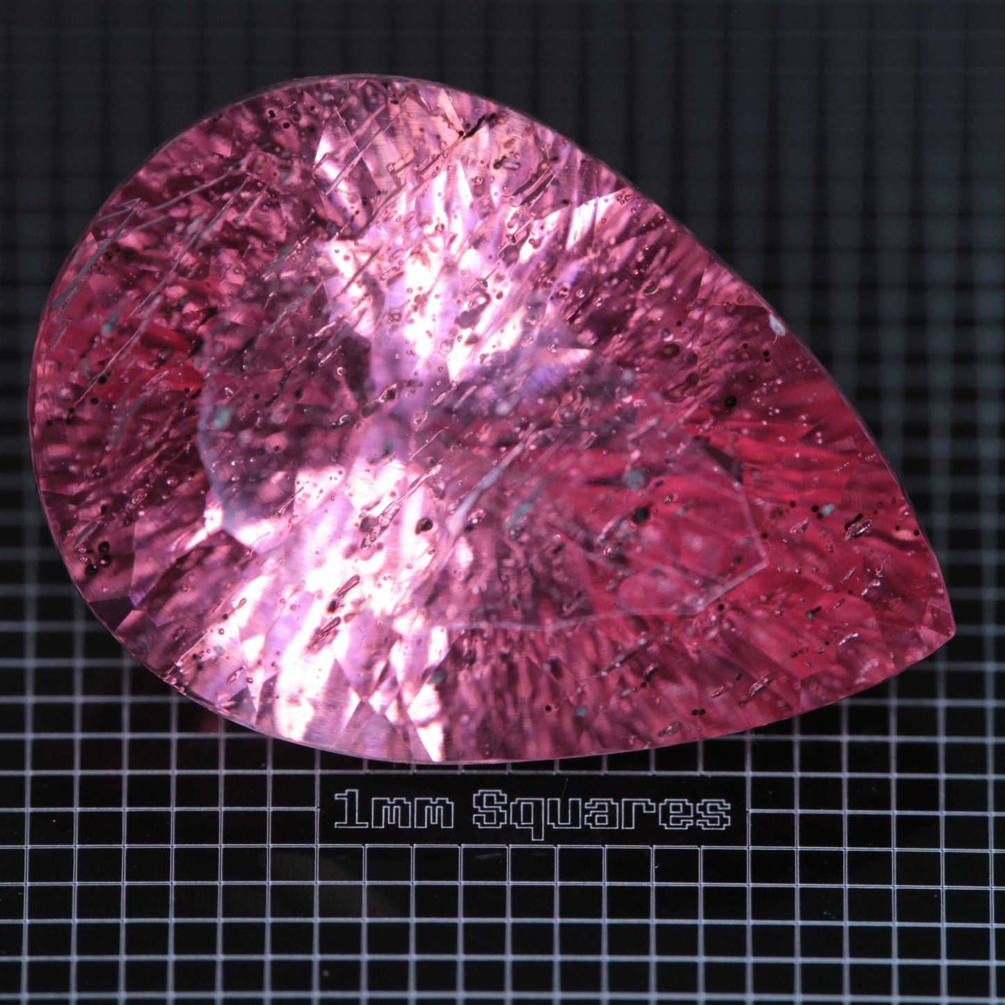 Faceted Strawberry Titanium Sapphire Pear gemstone