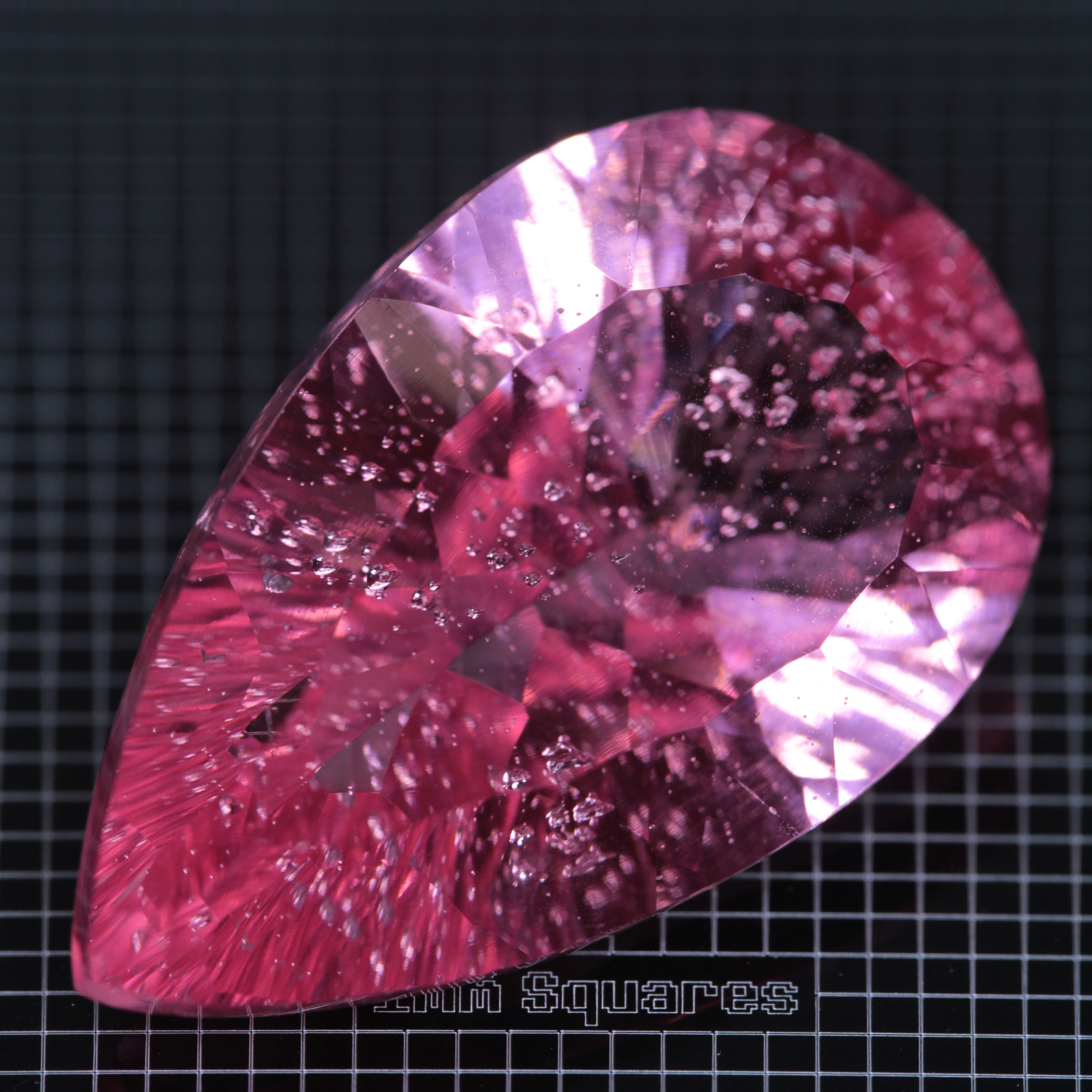 Faceted Strawberry Titanium Sapphire Pear gemstone