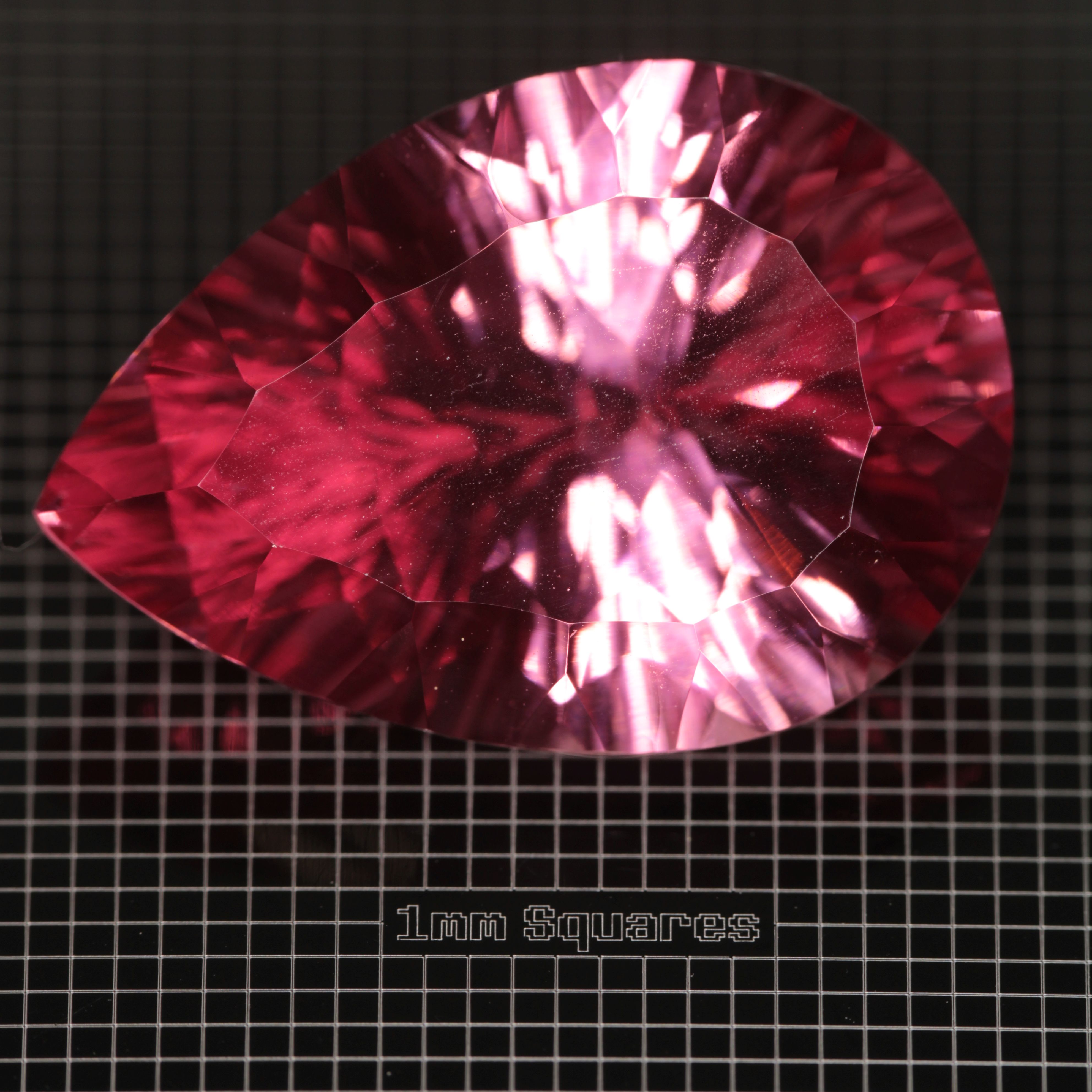 Faceted Strawberry Titanium Sapphire Pear gemstone