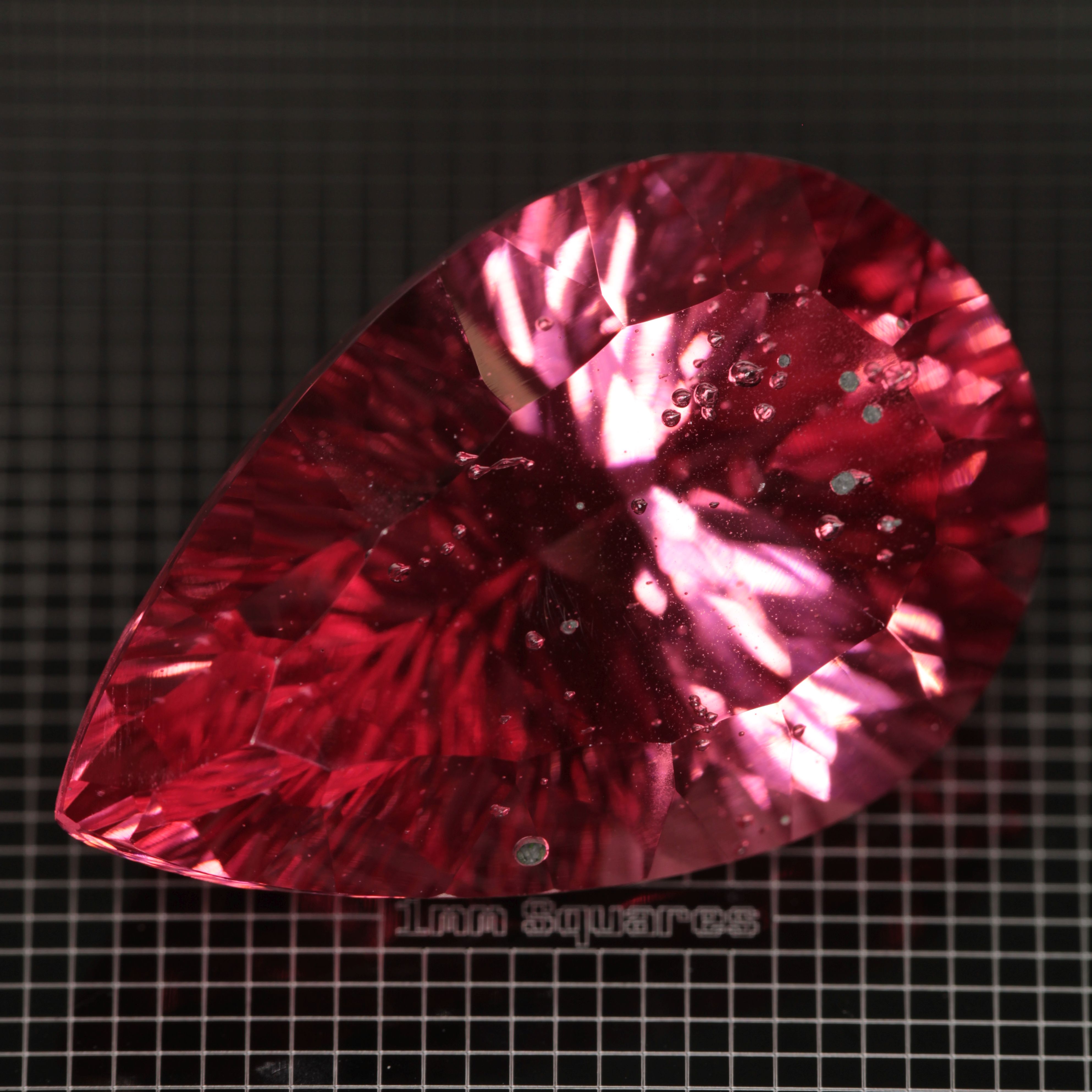 Faceted Strawberry Titanium Sapphire Pear gemstone