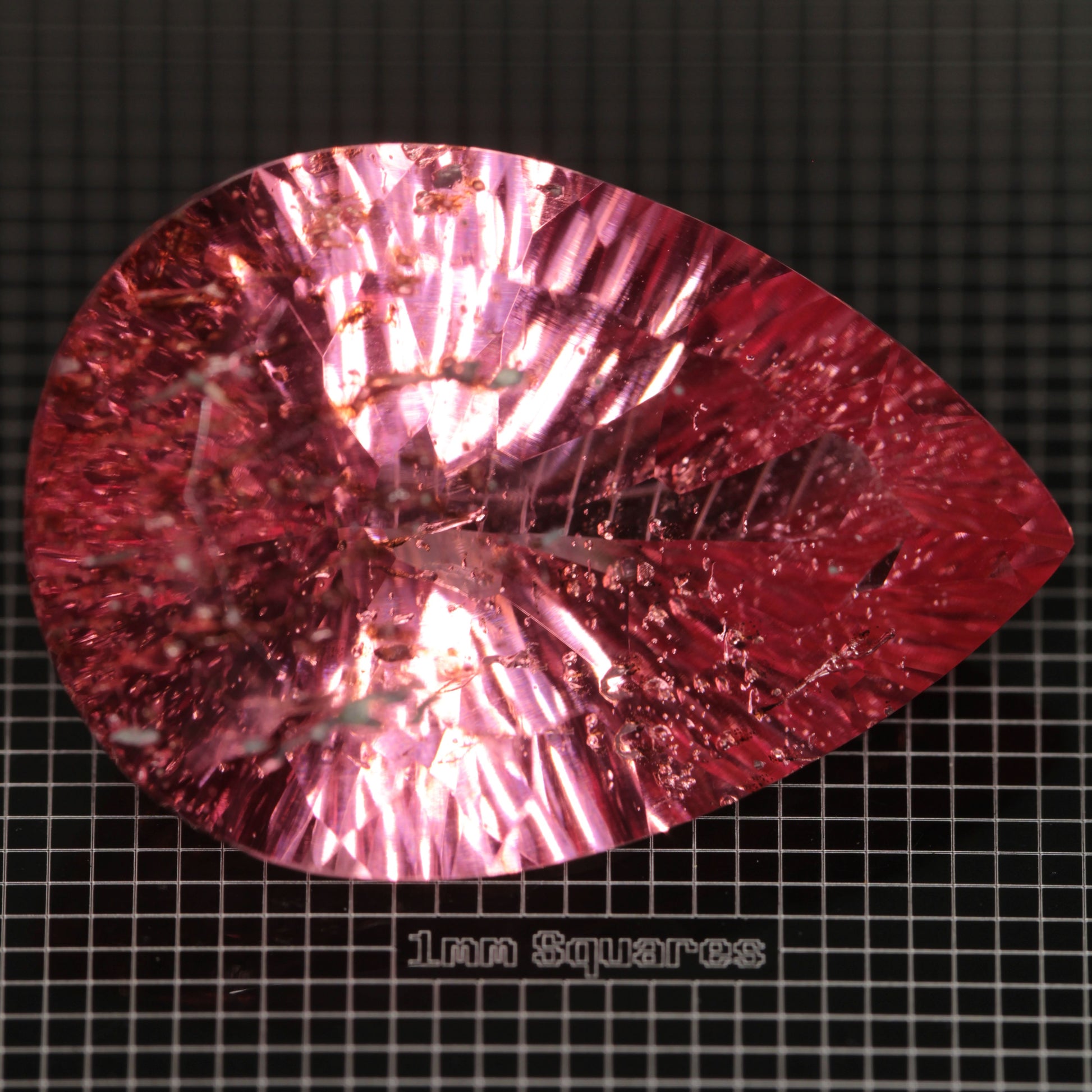 Faceted Strawberry Titanium Sapphire Pear gemstone