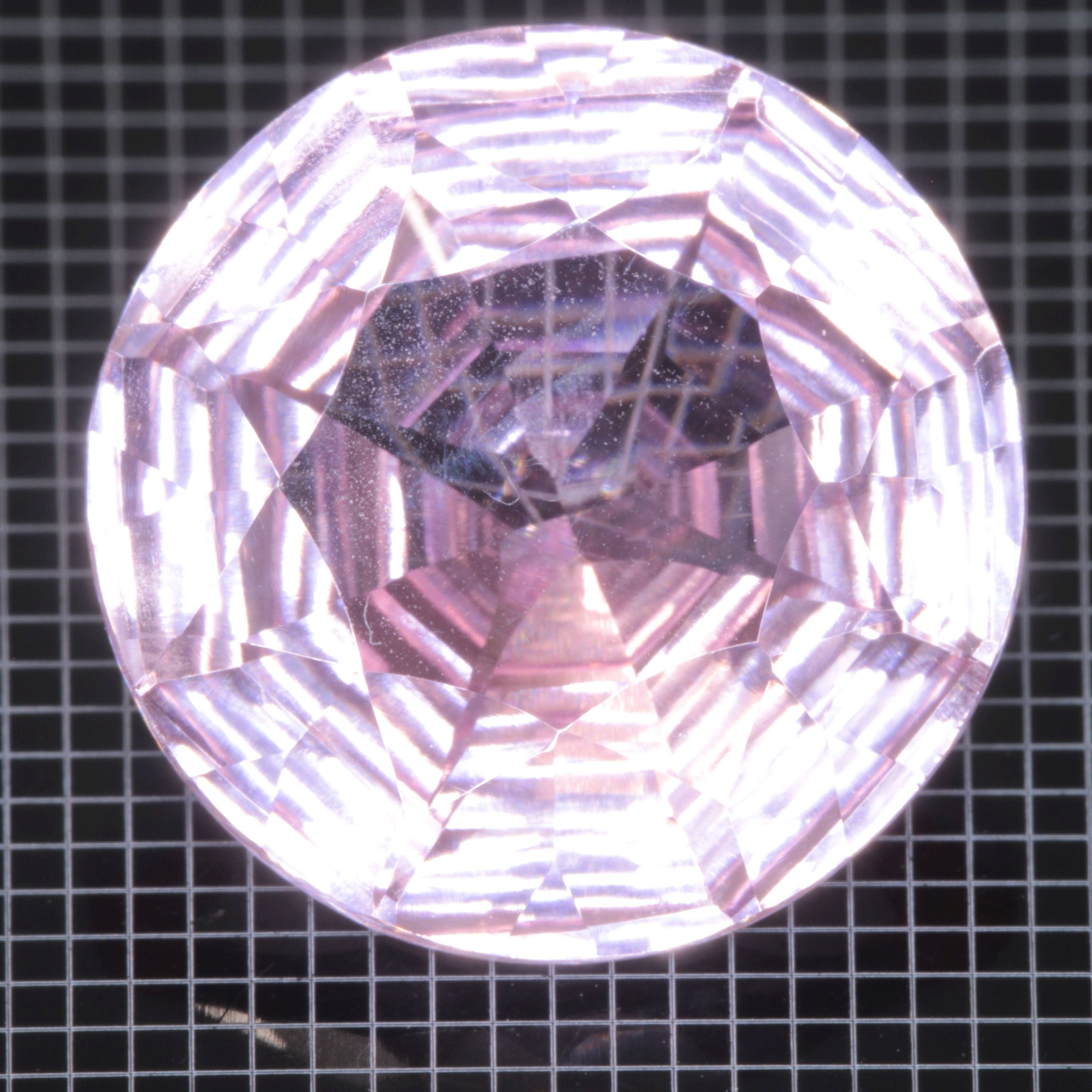 Faceted Strawberry Titanium Sapphire Round gemstone