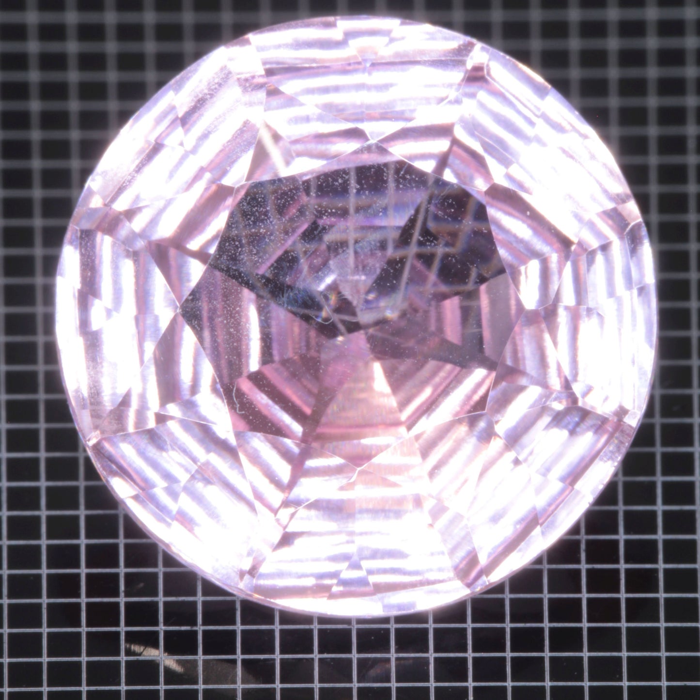 Faceted Strawberry Titanium Sapphire Round gemstone