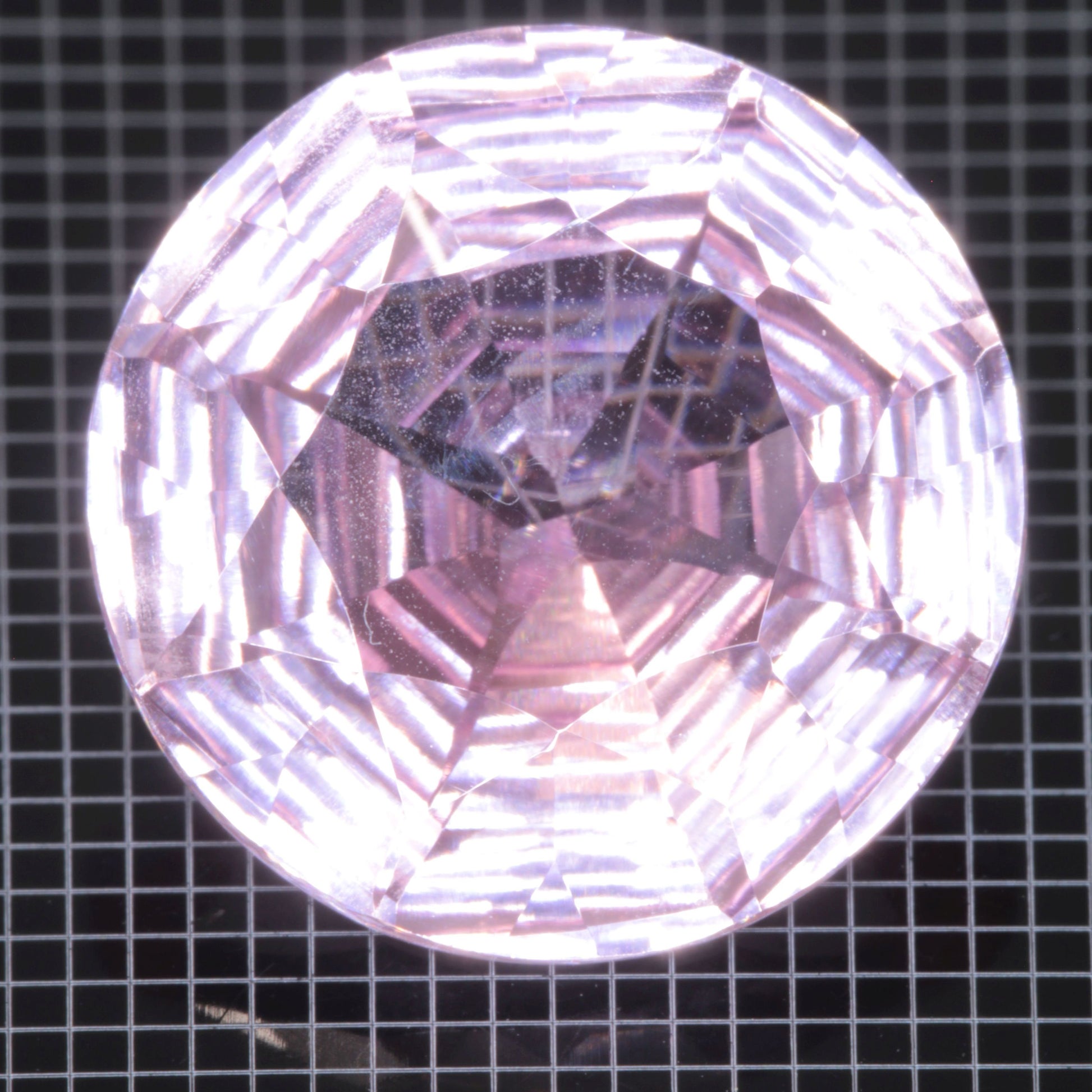 Faceted Strawberry Titanium Sapphire Round gemstone