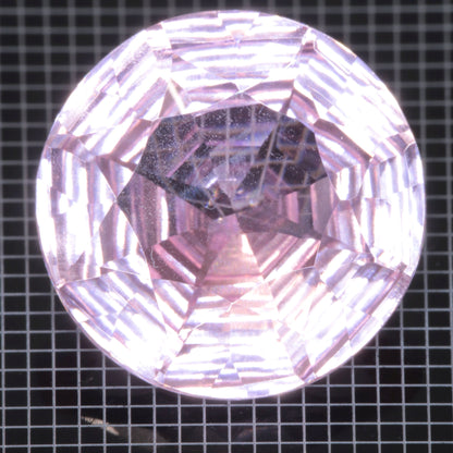 Faceted Strawberry Titanium Sapphire Round gemstone