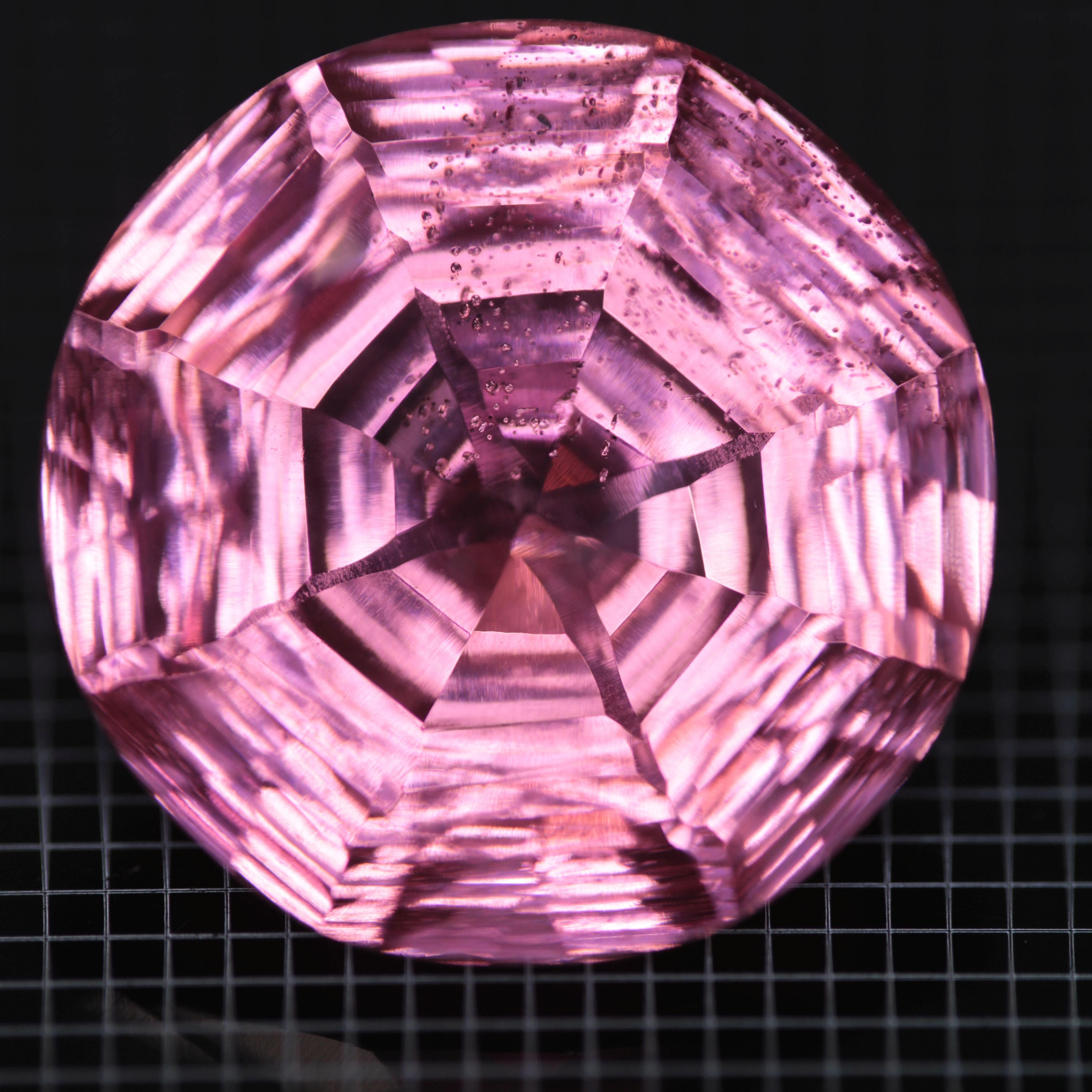 Faceted Strawberry Titanium Sapphire Round gemstone
