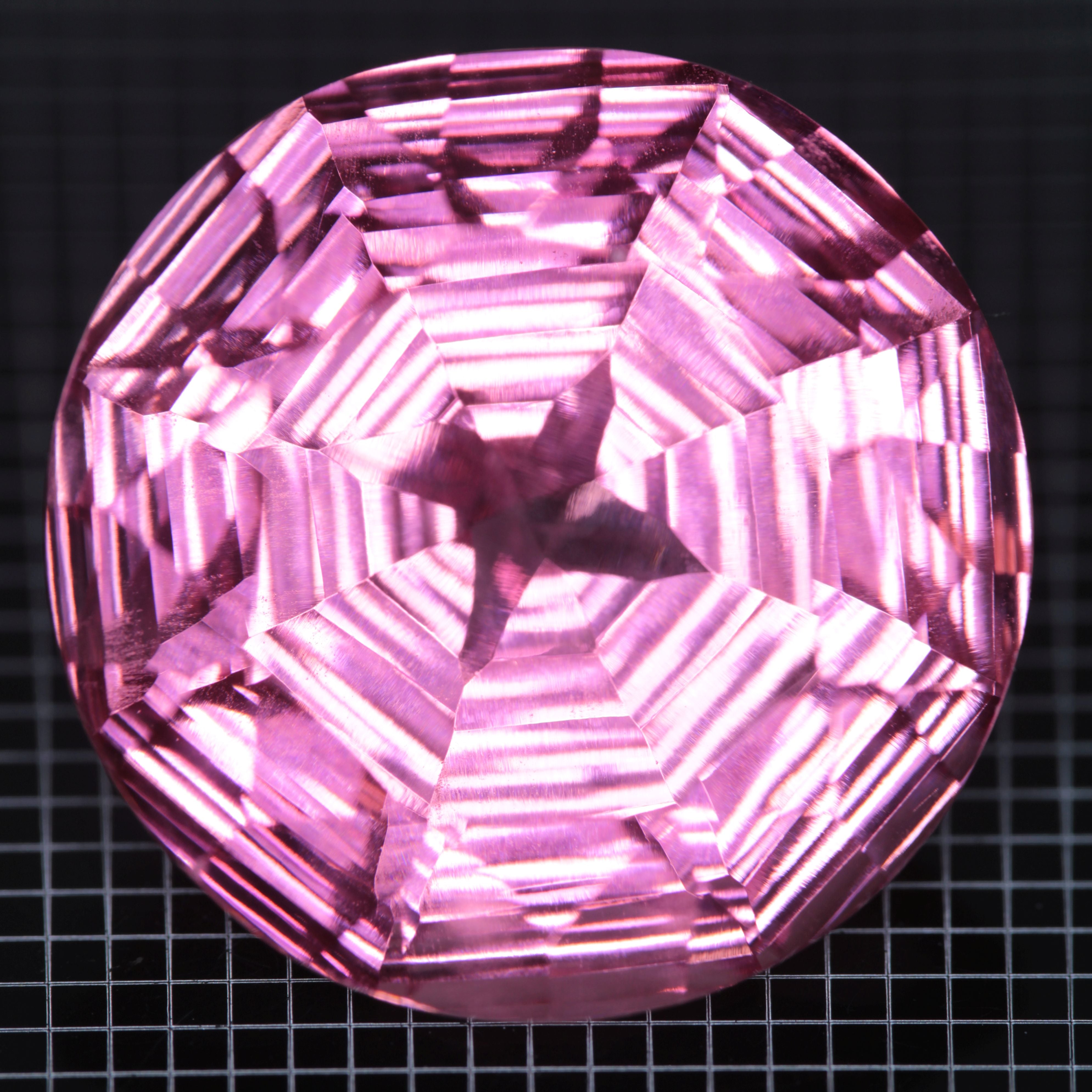 Faceted Strawberry Titanium Sapphire Round gemstone