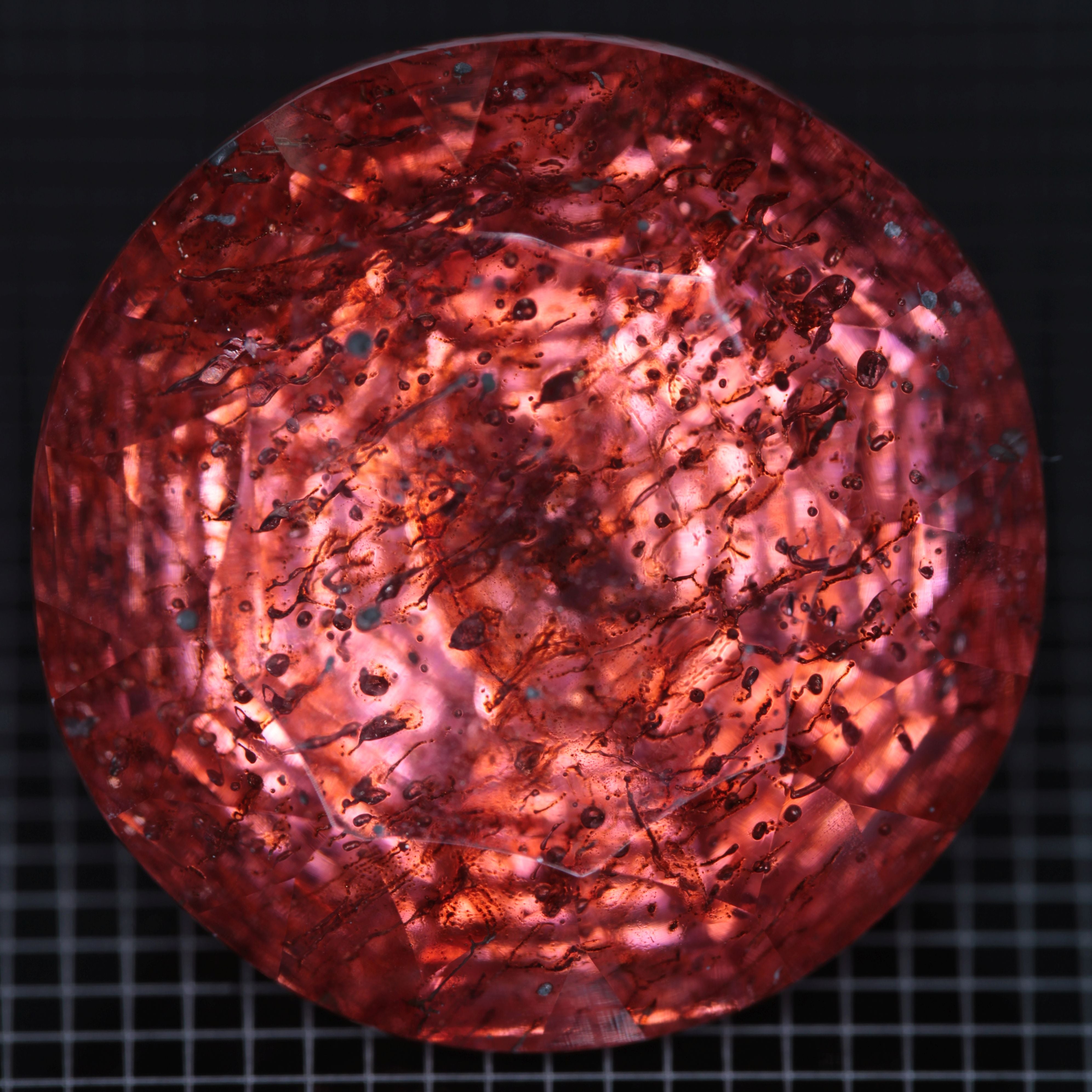 Faceted Strawberry Titanium Sapphire Round gemstone