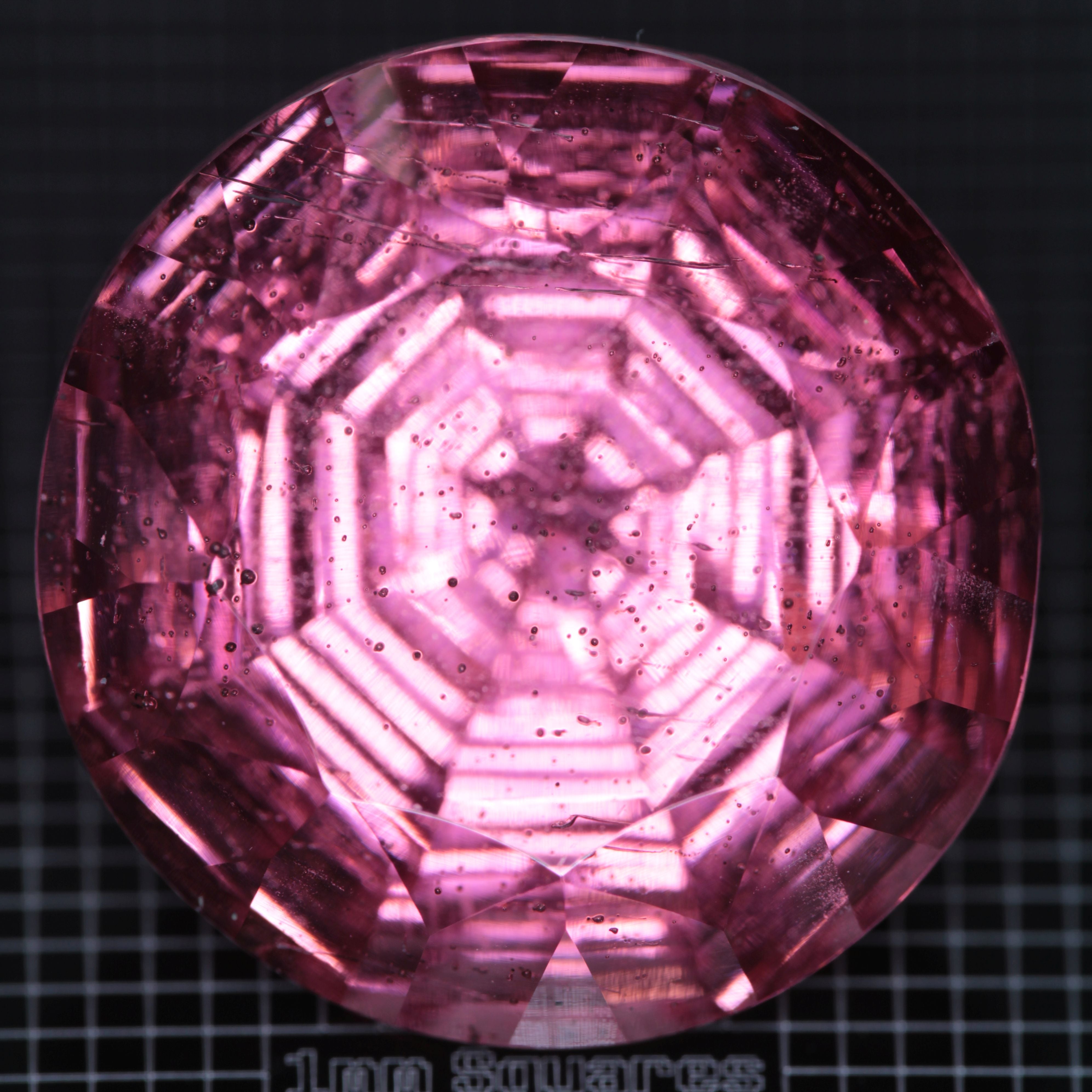 Faceted Strawberry Titanium Sapphire Round gemstone
