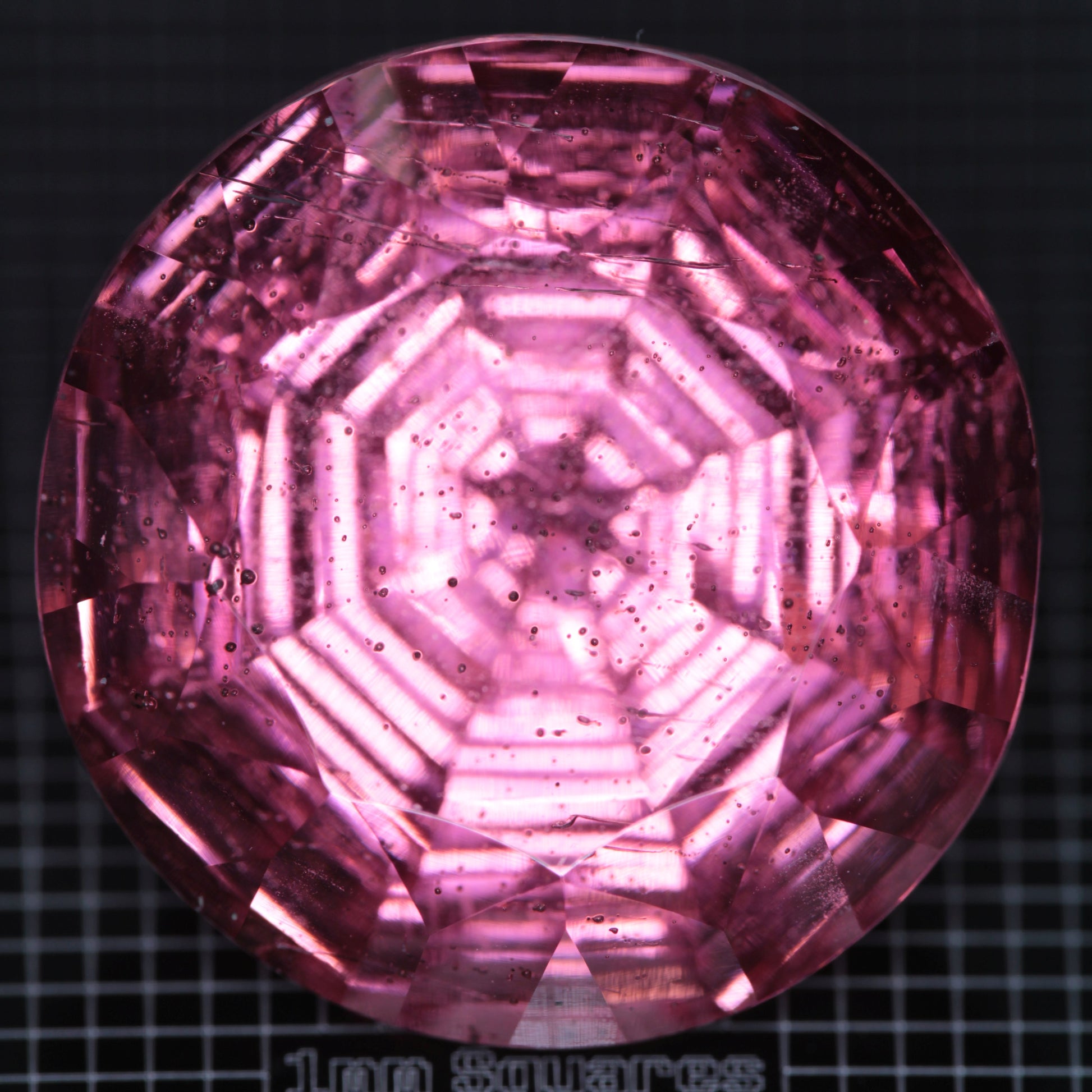 Faceted Strawberry Titanium Sapphire Round gemstone