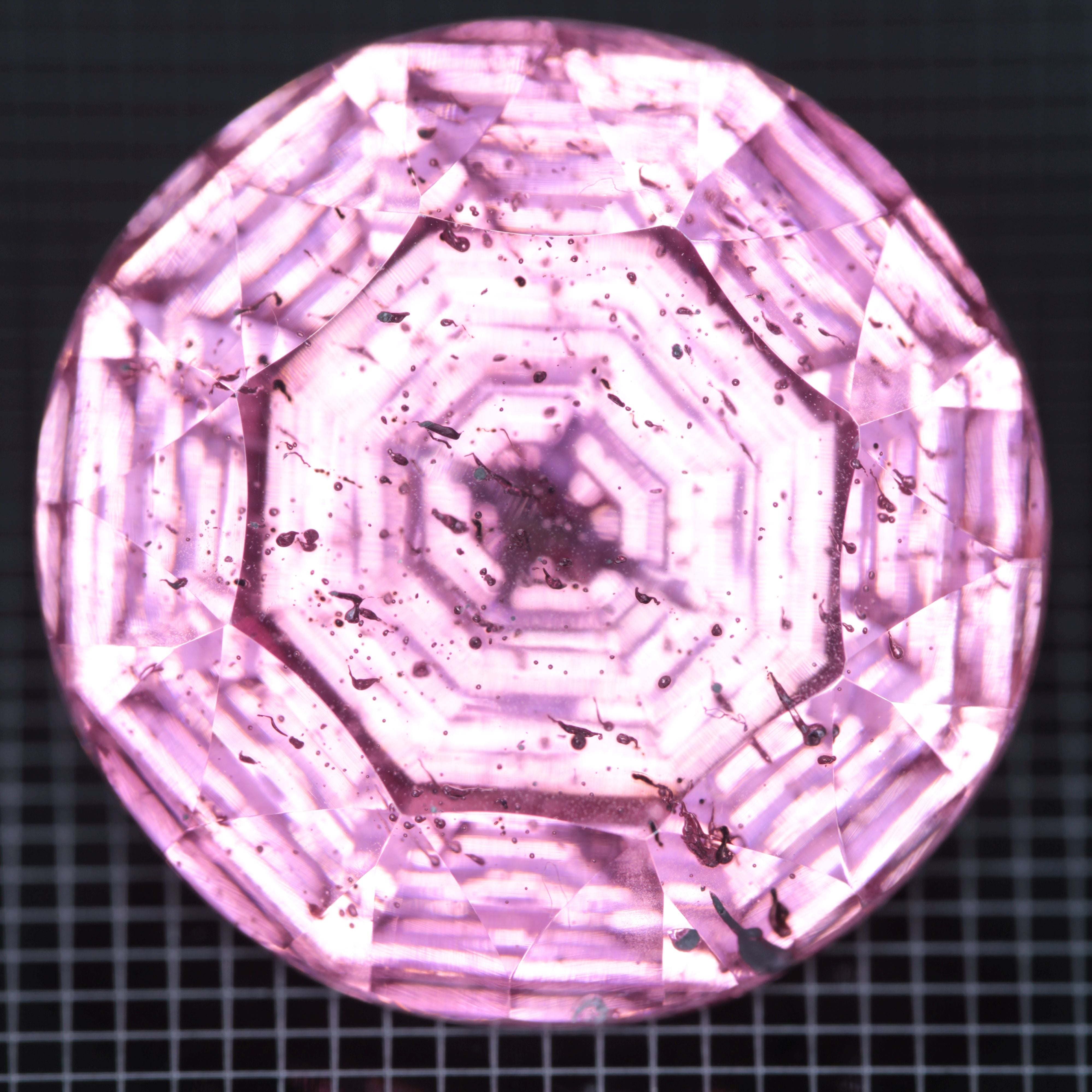 Faceted Strawberry Titanium Sapphire Round gemstone