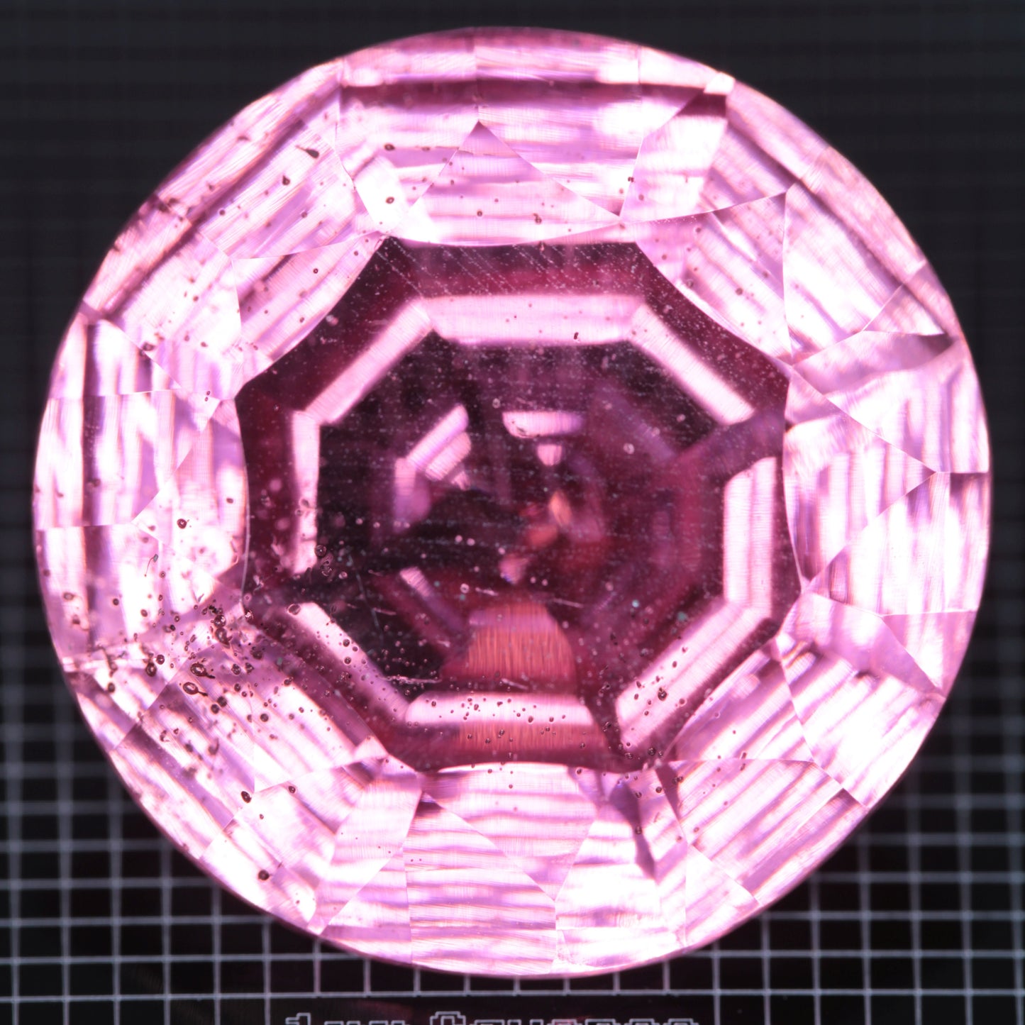 Faceted Strawberry Titanium Sapphire Round gemstone