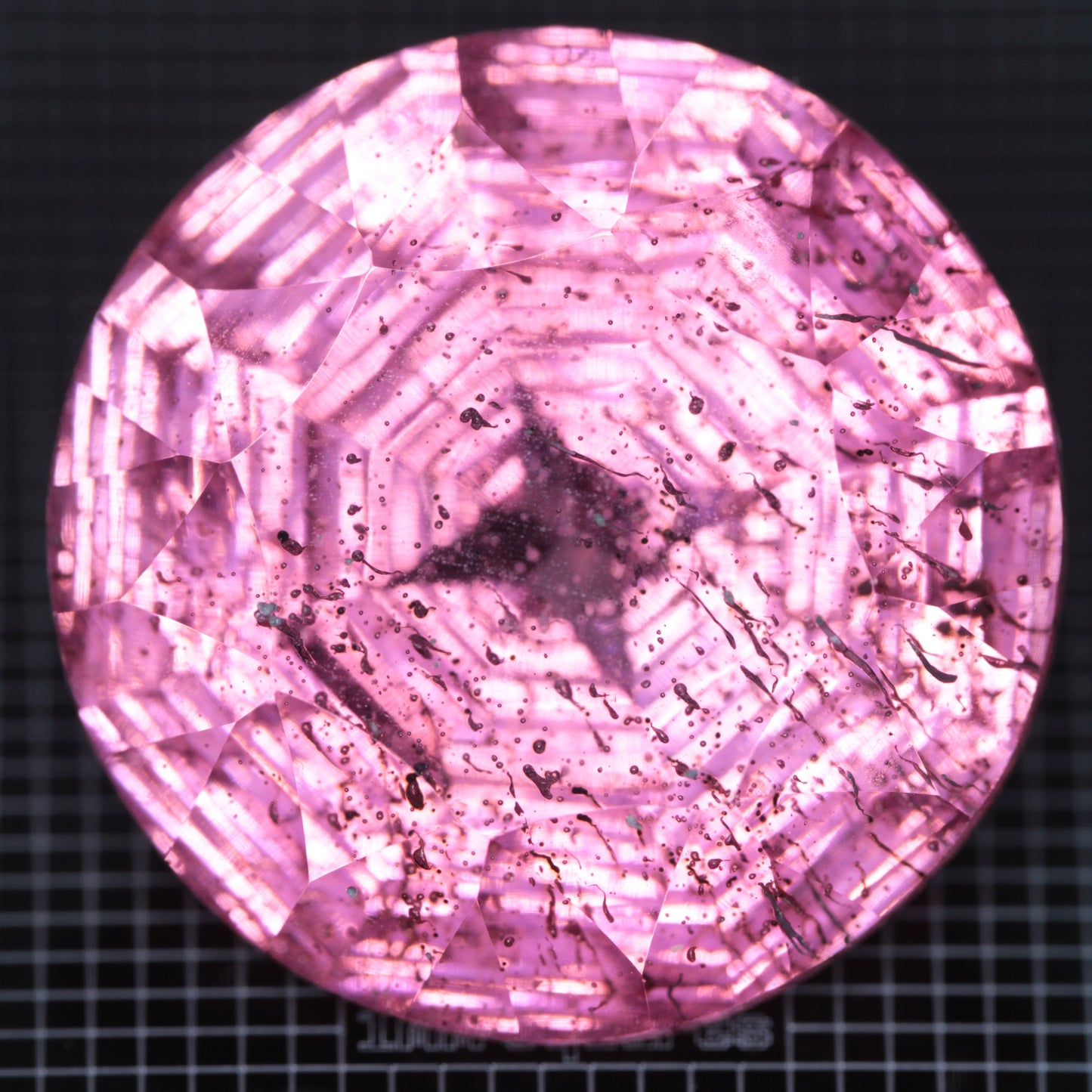 Faceted Strawberry Titanium Sapphire Round gemstone