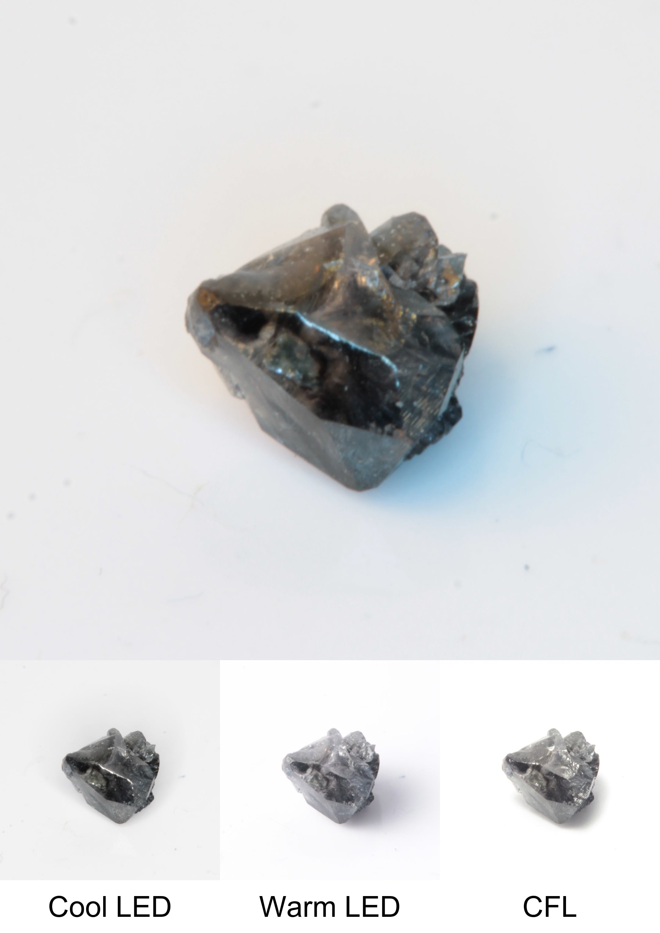 Synthetic Flux Playbutton Sapphire Gemstone Grown by Gems of Science on a white background showing color shift under different lighting