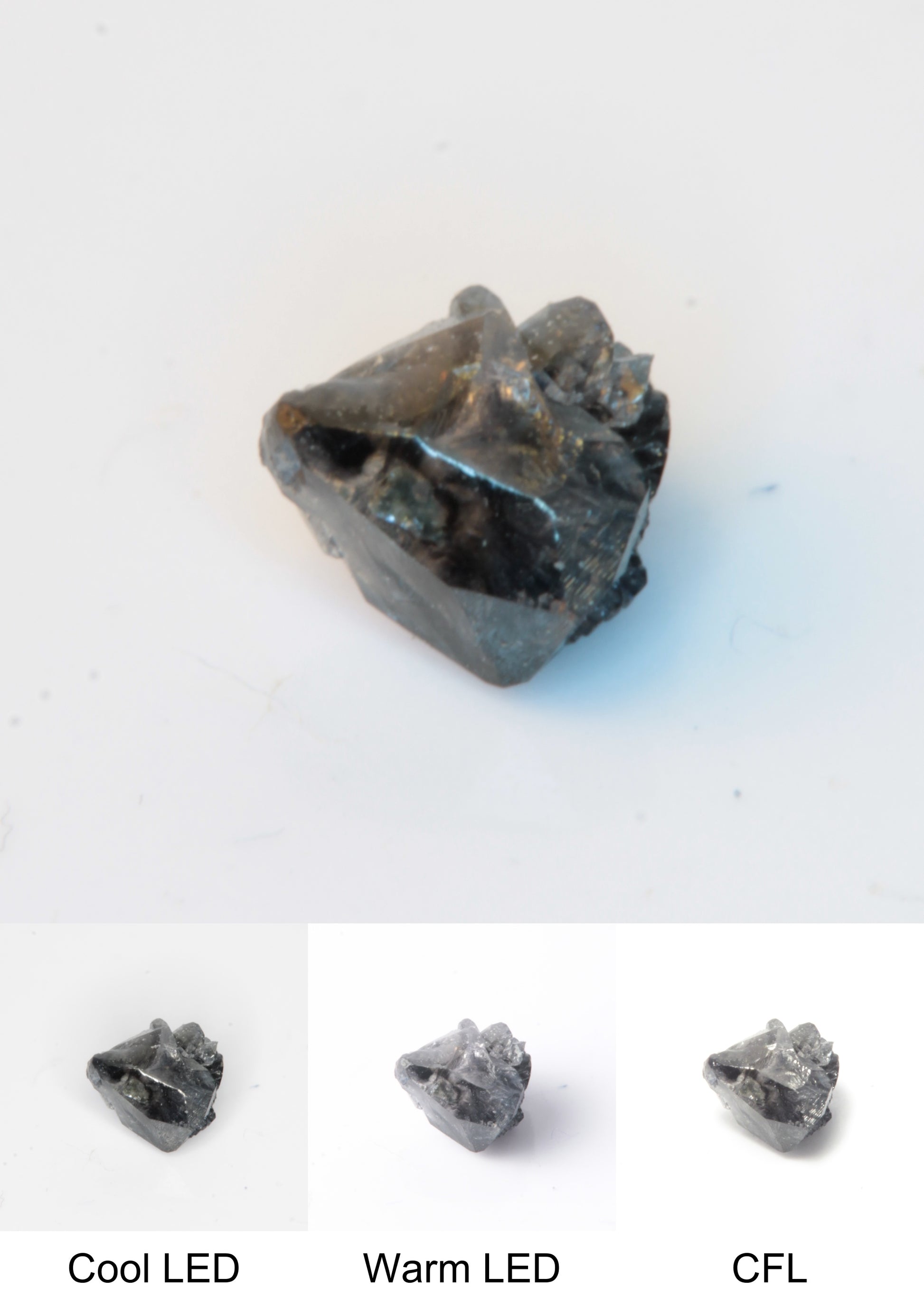 Synthetic Flux Playbutton Sapphire Gemstone Grown by Gems of Science on a white background showing color shift under different lighting