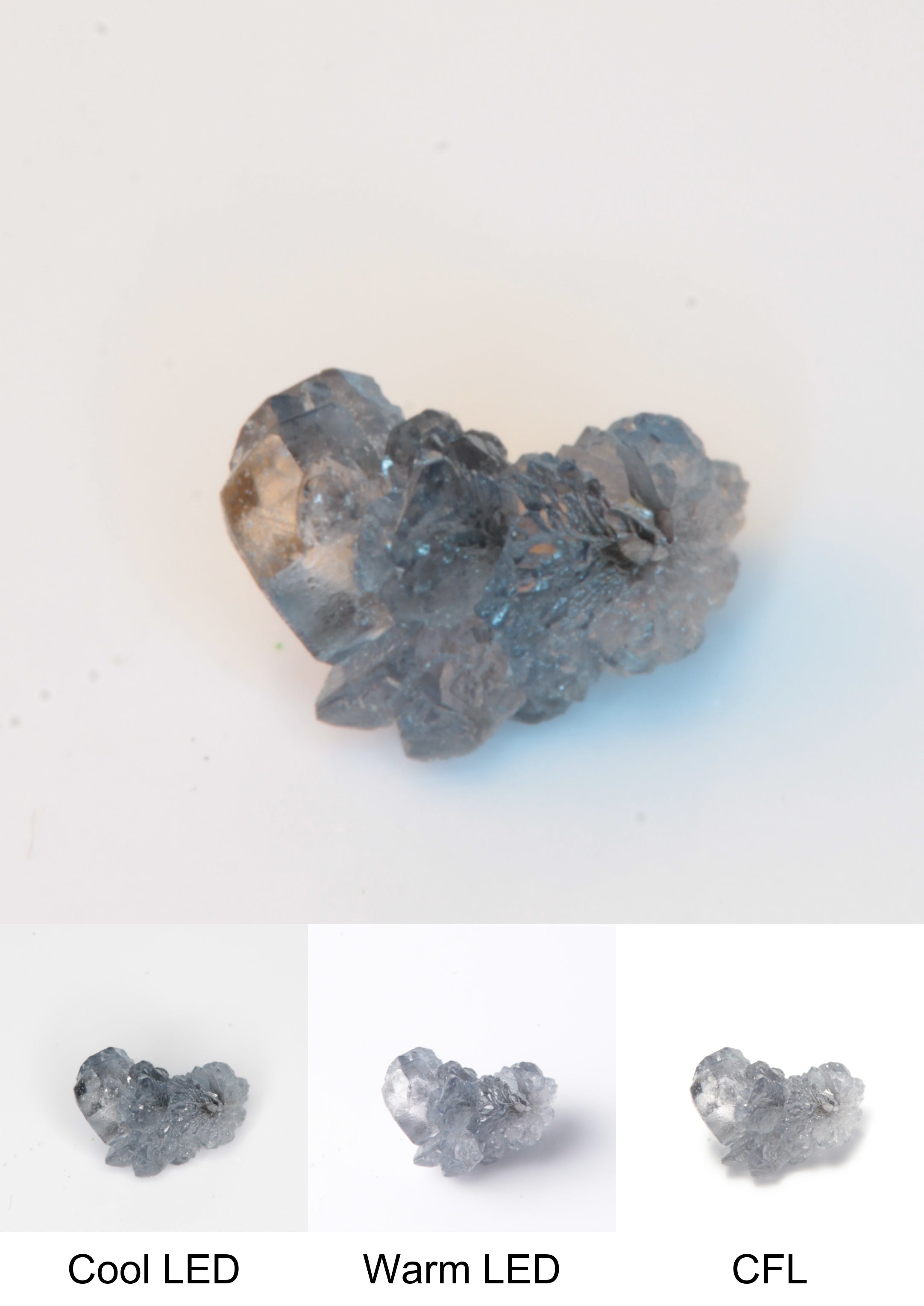 Synthetic Flux Playbutton Sapphire Gemstone Grown by Gems of Science on a white background showing color shift under different lighting