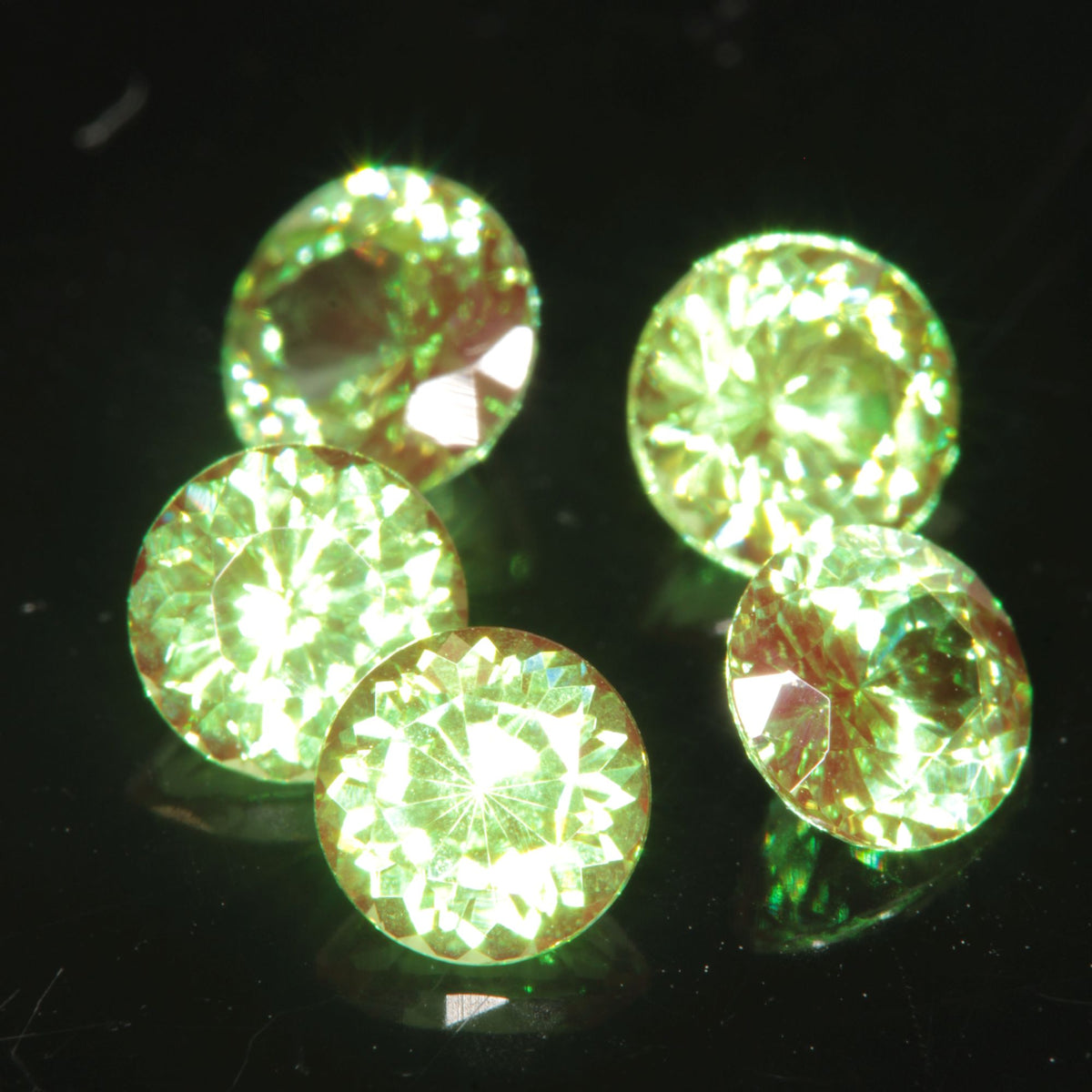 Round Cut Green and Red “Space Laser” YAG gem