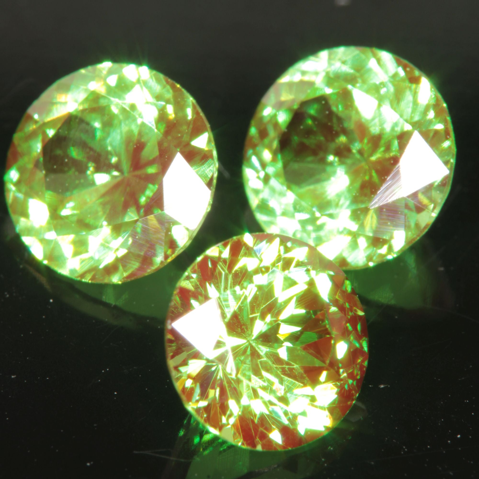 Round Cut Green and Red “Space Laser” YAG gem