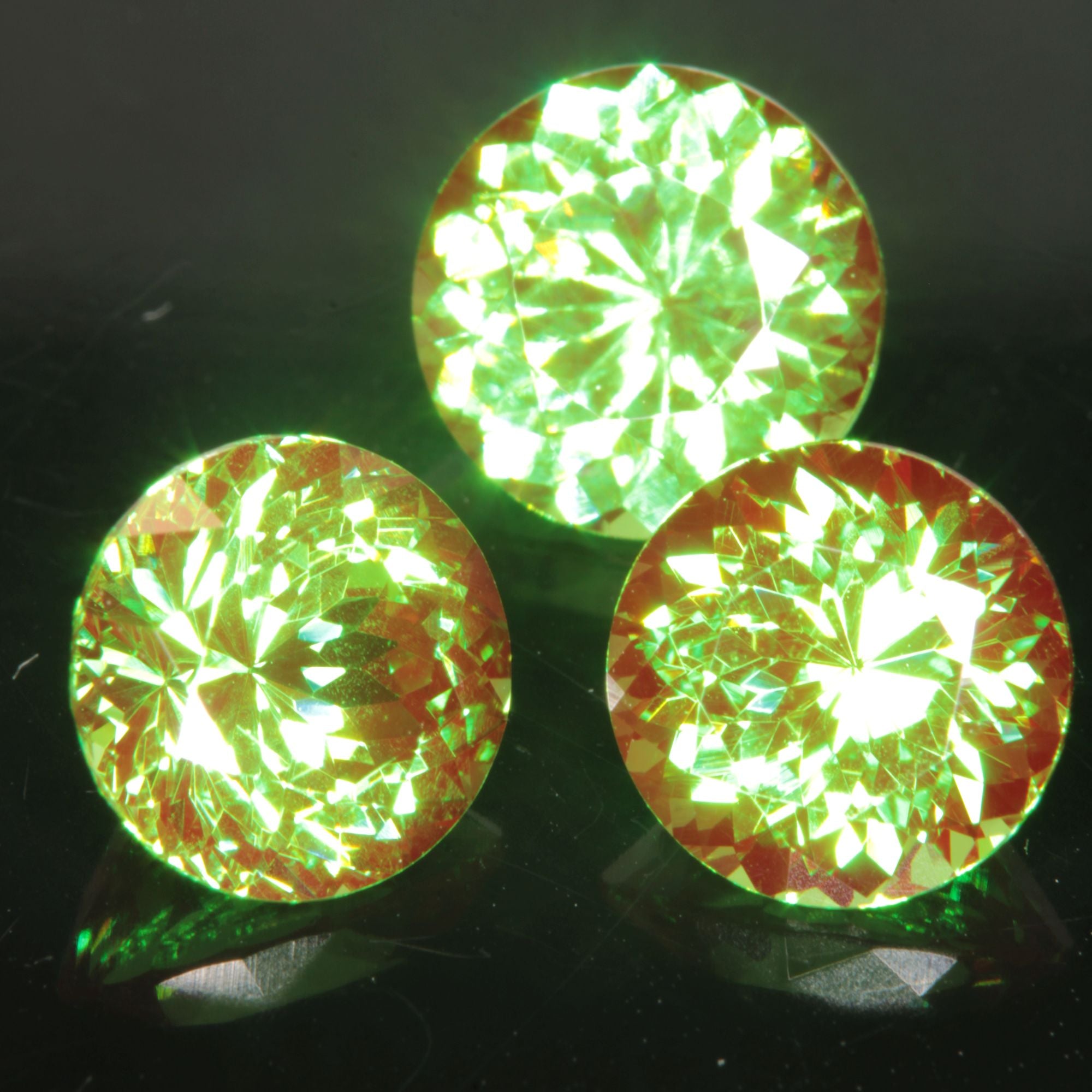 Round Cut Green and Red “Space Laser” YAG gem