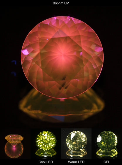 Faceted Yellow Ce/Nd YAG Bullseye Round Gemstone with a spot of Pink Fluorescence at the culet of the Yellow Crystal