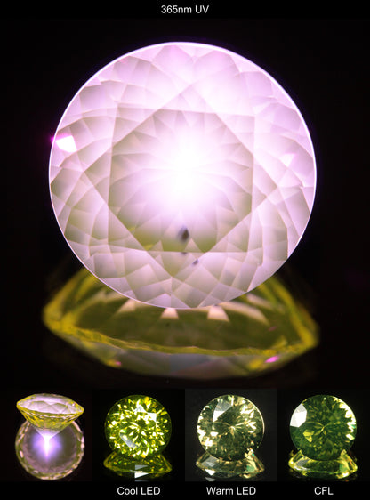 Faceted Yellow Ce/Nd YAG Bullseye Round Gemstone with a spot of Pink Fluorescence at the culet of the Yellow Crystal