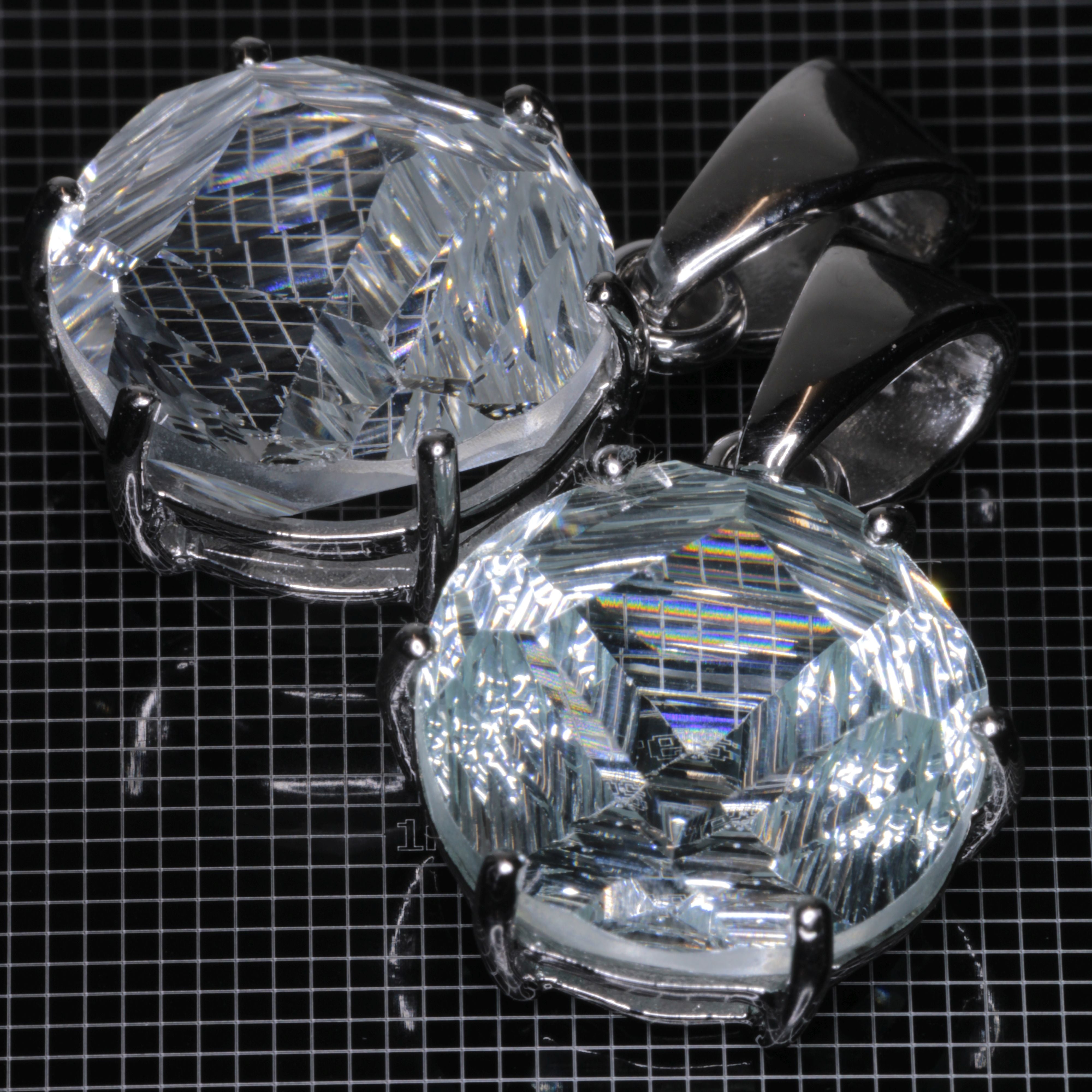 Fantasy Cut Light Blue Yb:YAG gemstones in sterling silver pendants