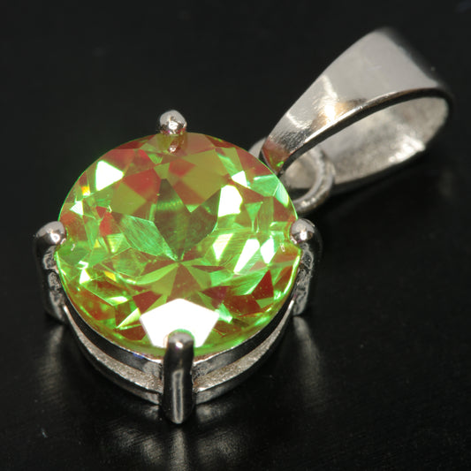 Green “Space Laser” Garnet Pendant on a black background