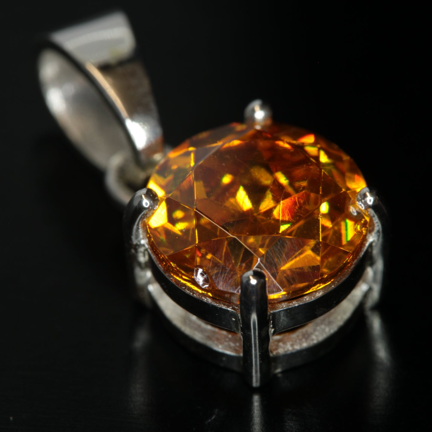 Round Cut Orange BGO20 pendant on a black background