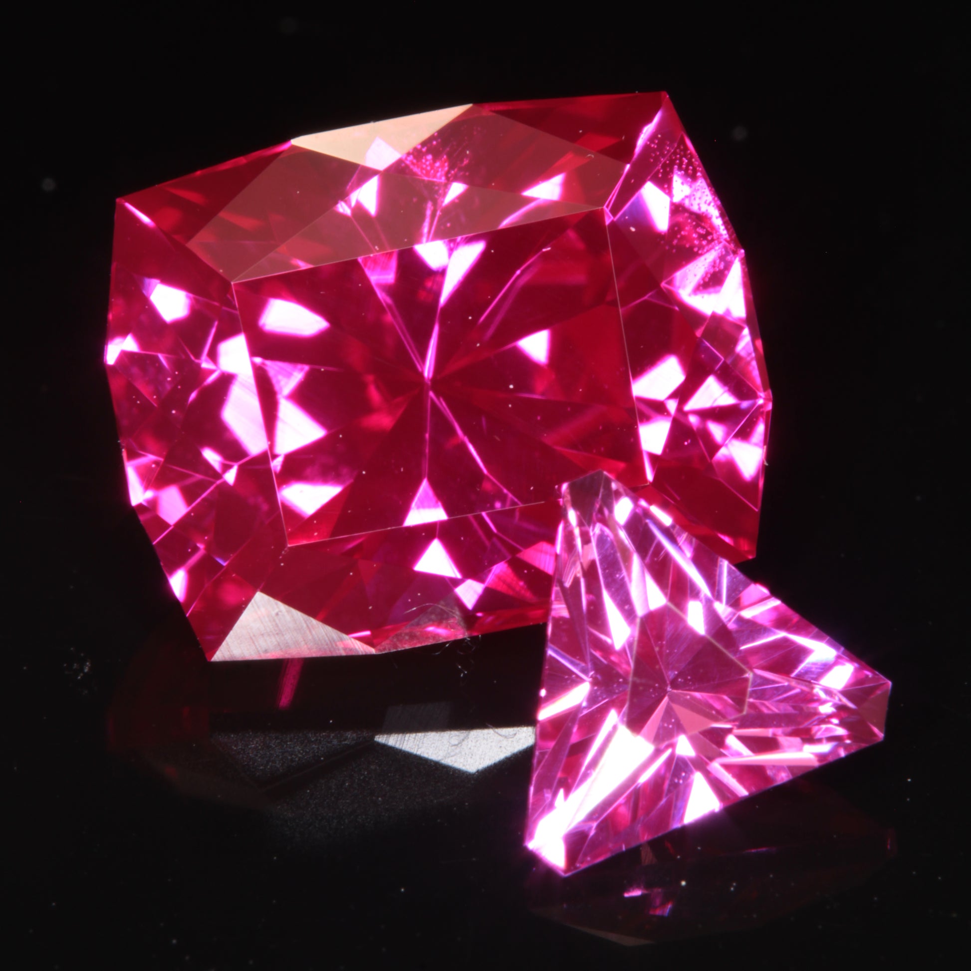 Two Pink Rubies, a trillion and a cushion