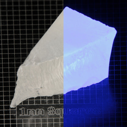 Wedge of LSO Gem Rough on a dark background, split between normal light (left) and UV (right) to show blue fluorescent glow.