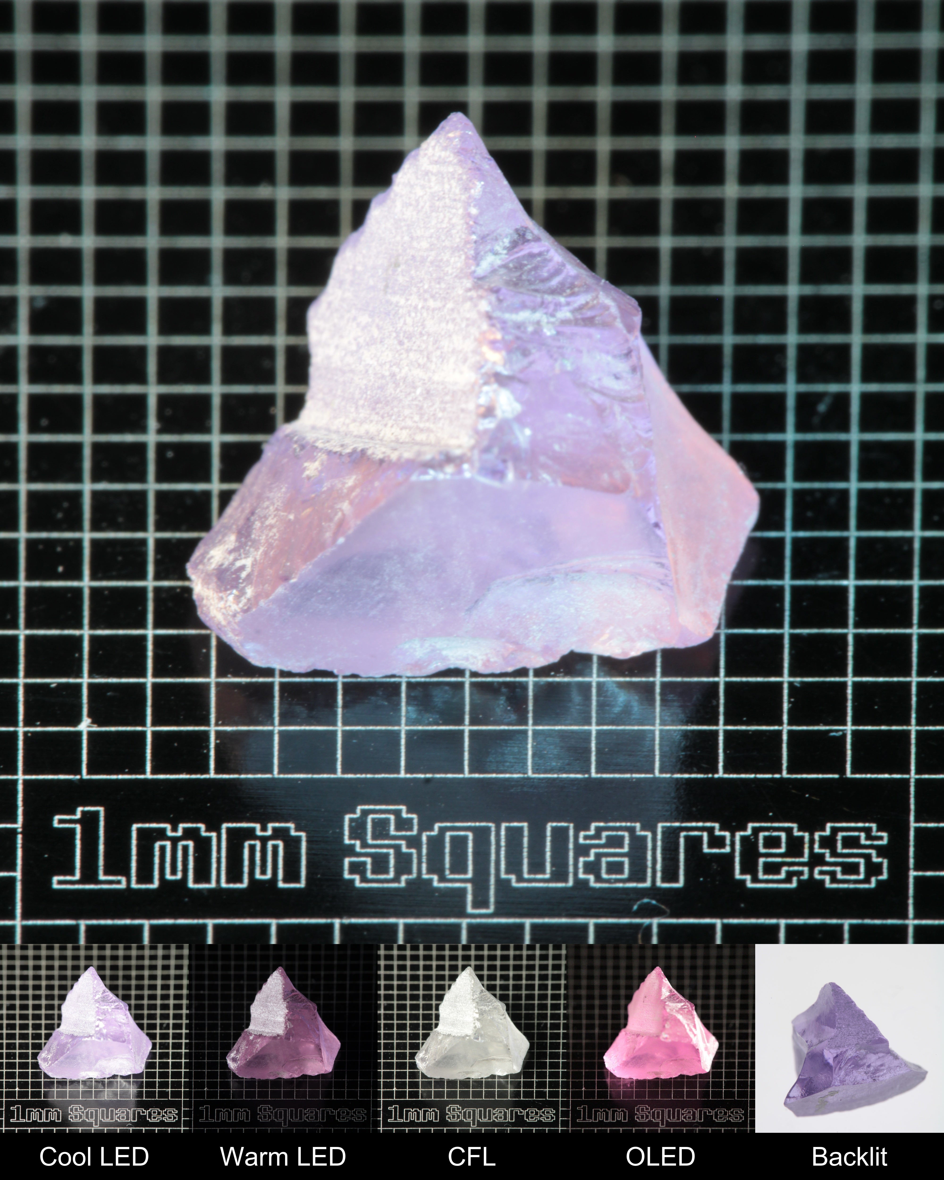 Nd:GGG Chunk Gem Rough Under Multiple Lights Showing the Color Change