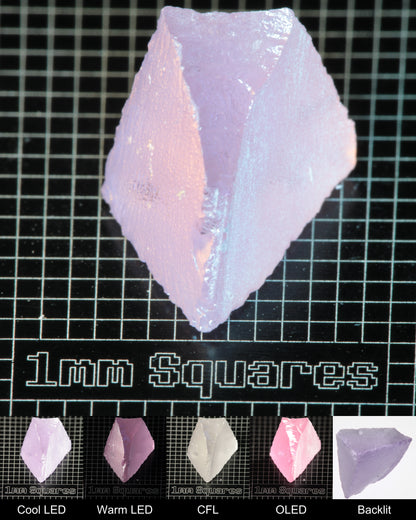 Nd:GGG Wedge Gem Rough Under Multiple Lights Showing the Color Change