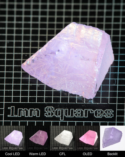 Nd:GGG Wedge Gem Rough Under Multiple Lights Showing the Color Change