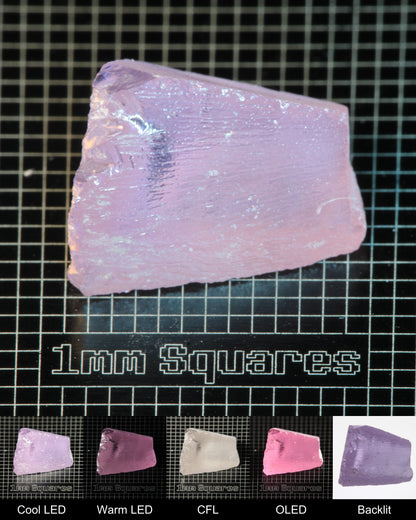 Nd:GGG Wedge Gem Rough Under Multiple Lights Showing the Color Change