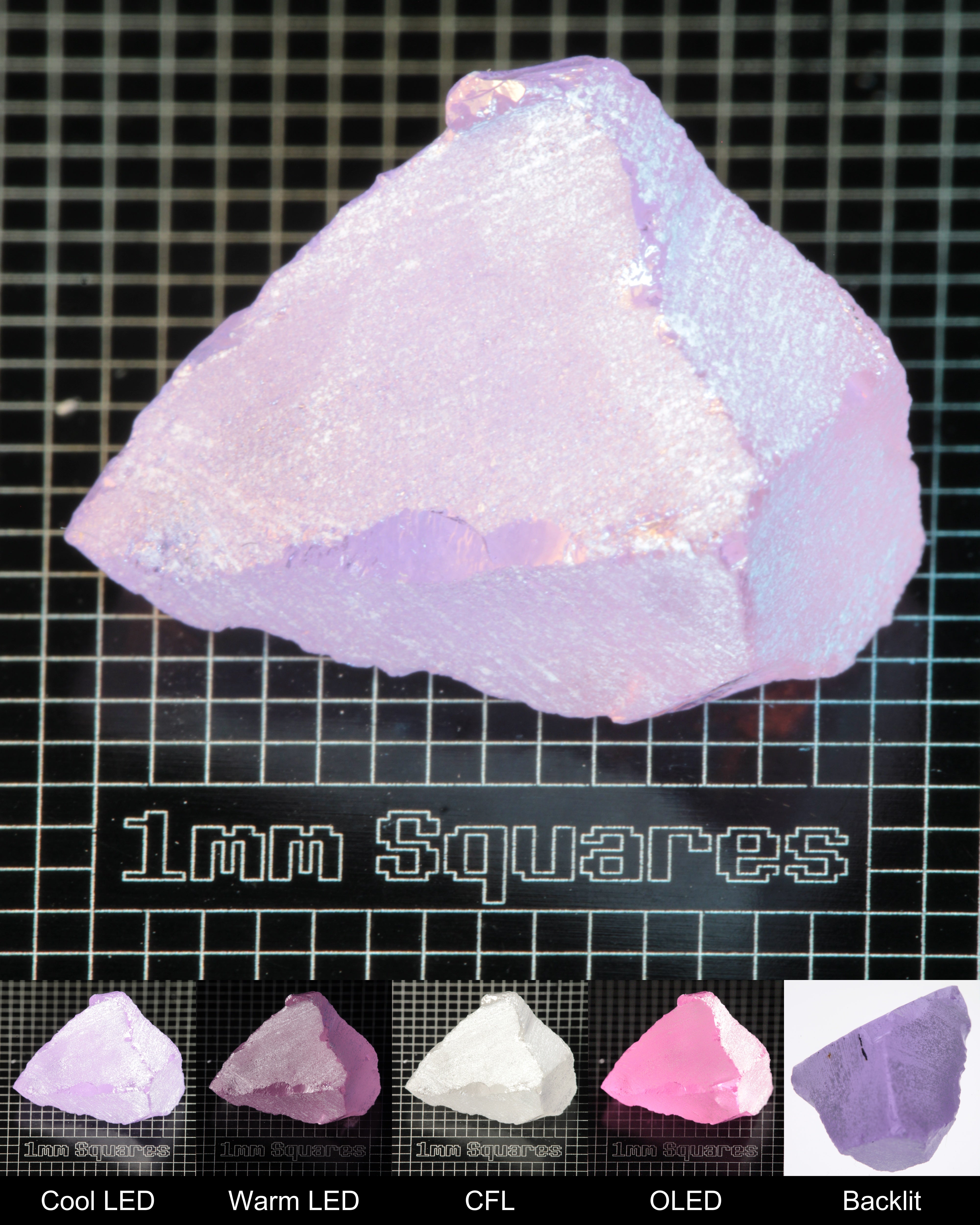 Nd:GGG Chunk Gem Rough Under Multiple Lights Showing the Color Change