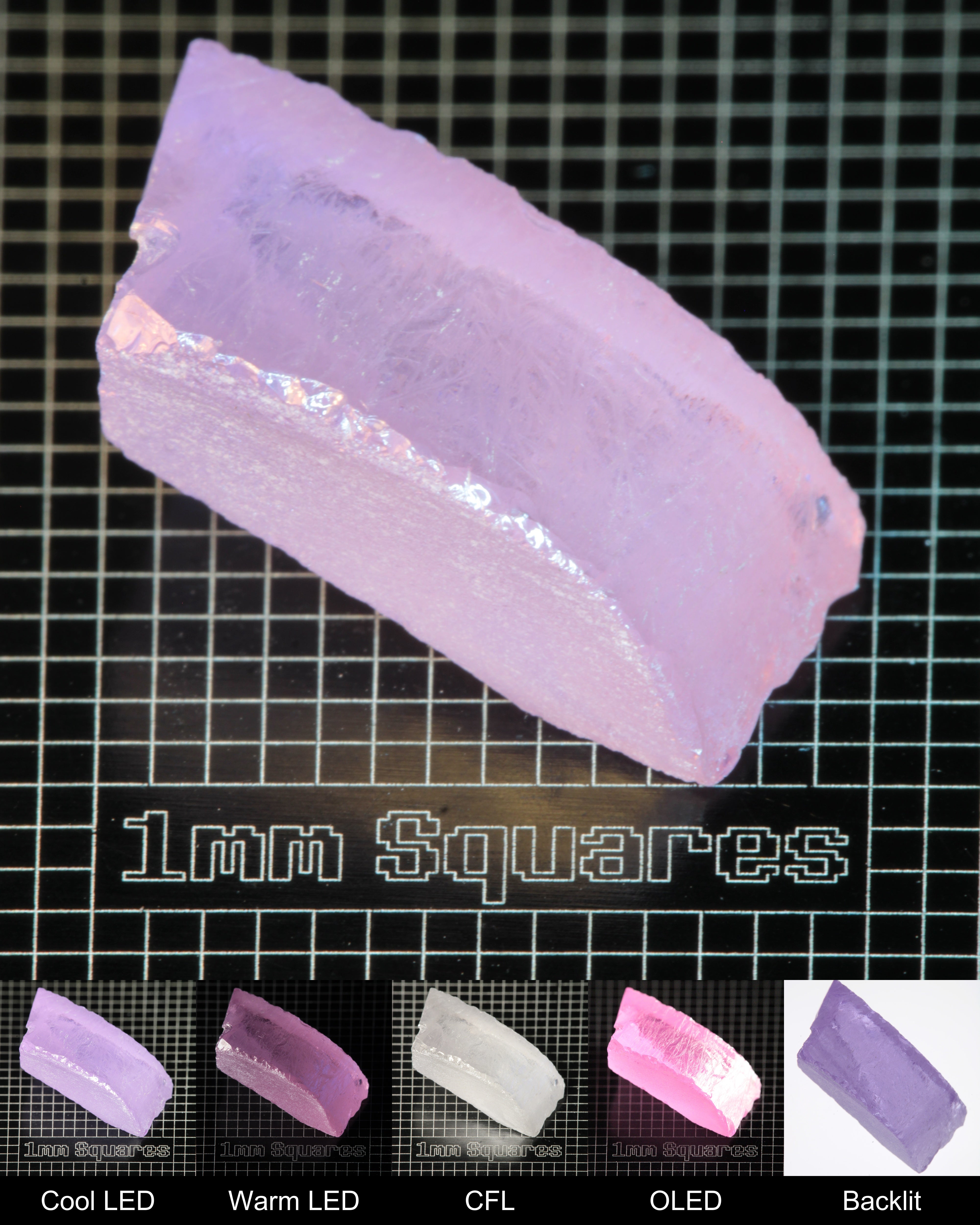 Nd:GGG Edge Gem Rough Under Multiple Lights Showing the Color Change