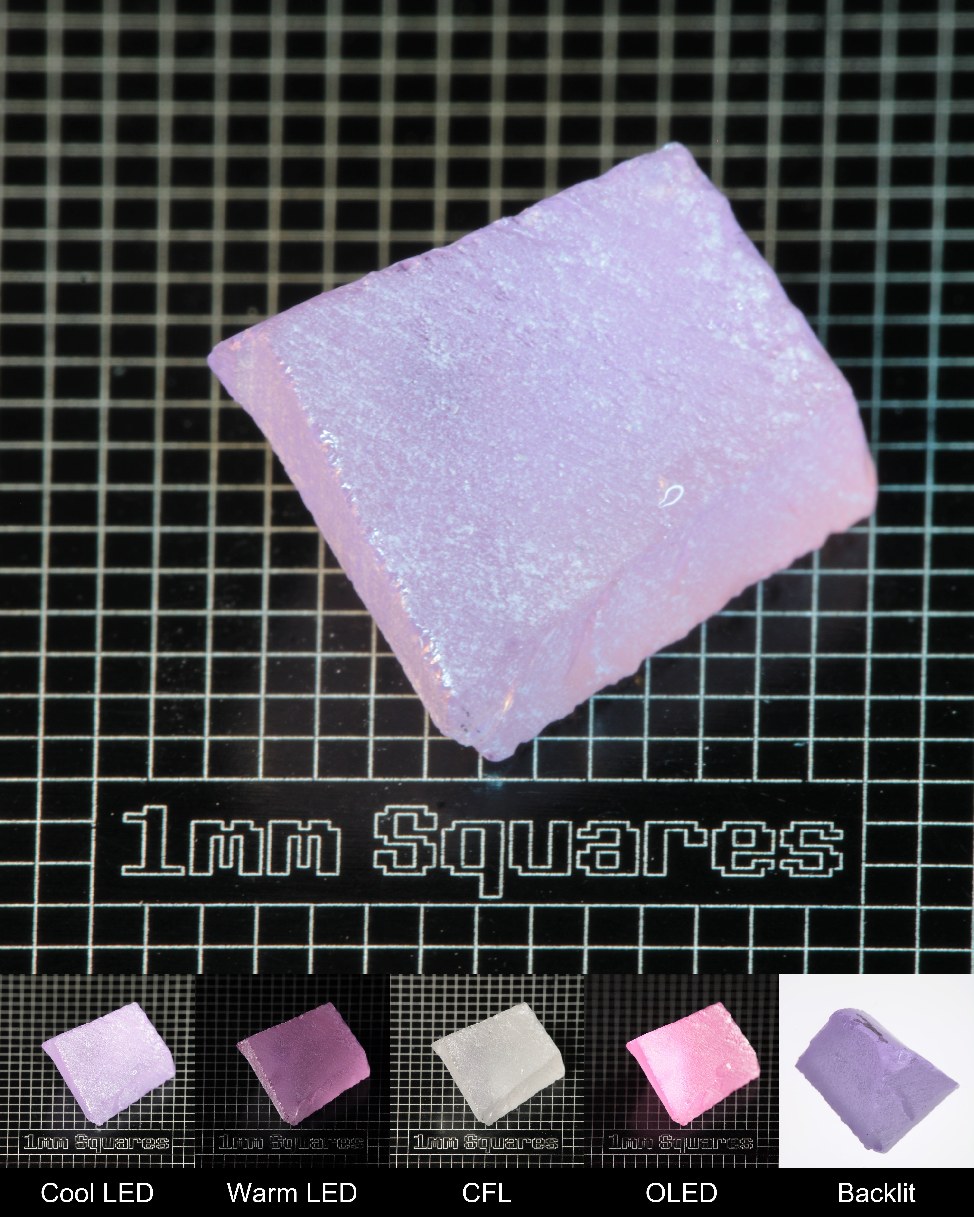 Nd:GGG Triangular Wedge Gem Rough Under Multiple Lights Showing the Color Change