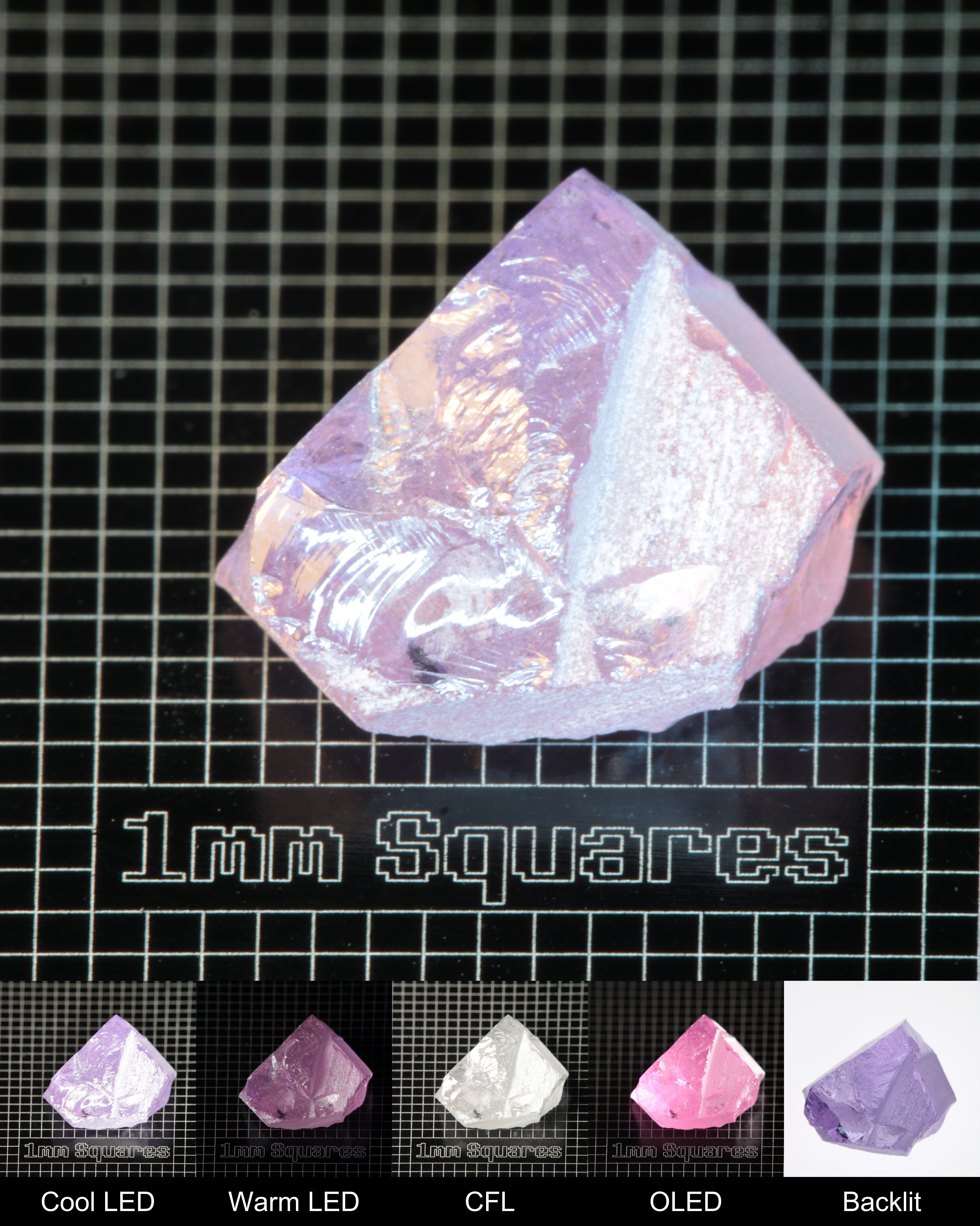 Nd:GGG Chunk Gem Rough Under Multiple Lights Showing the Color Change