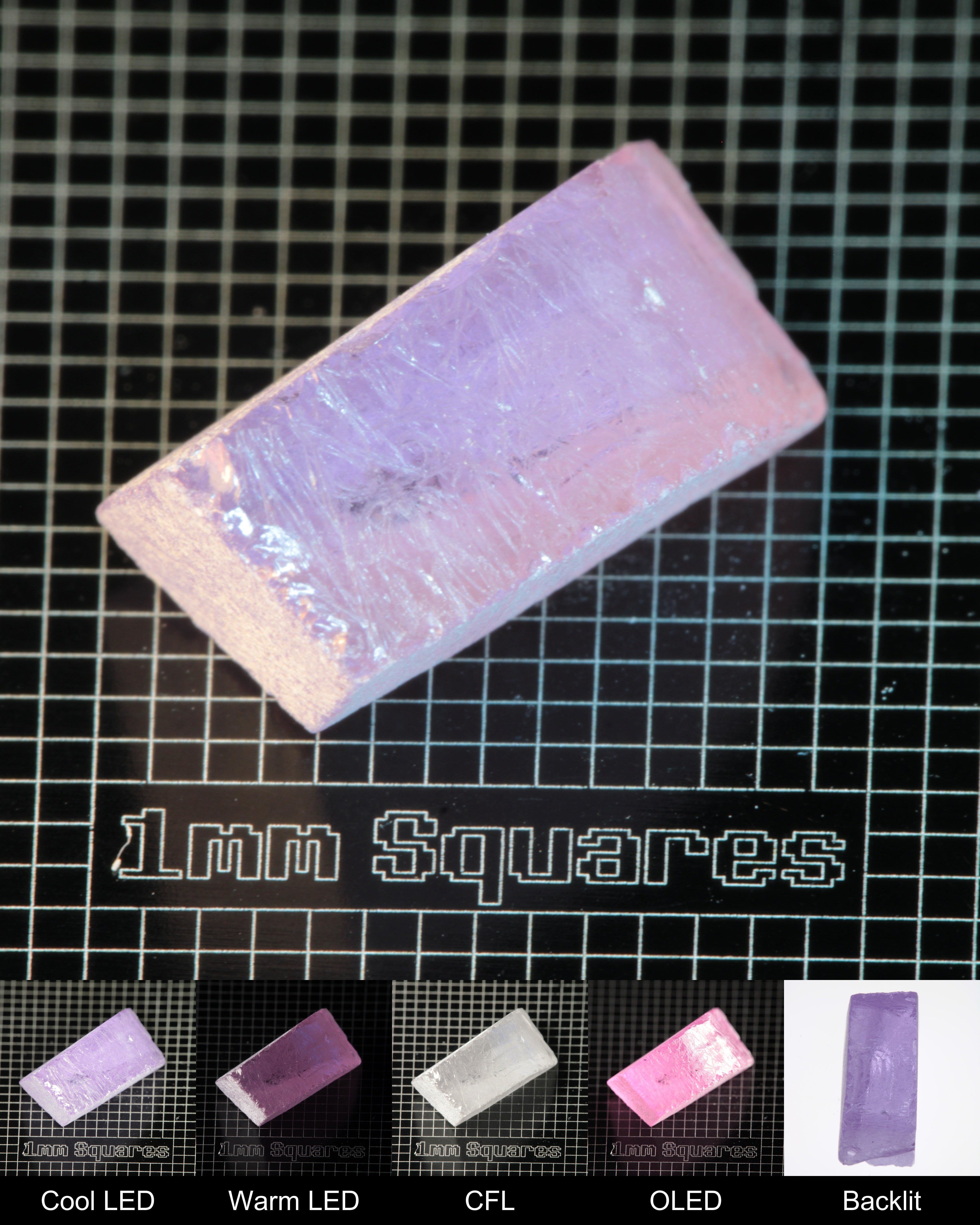 Nd:GGG Edge Gem Rough Under Multiple Lights Showing the Color Change