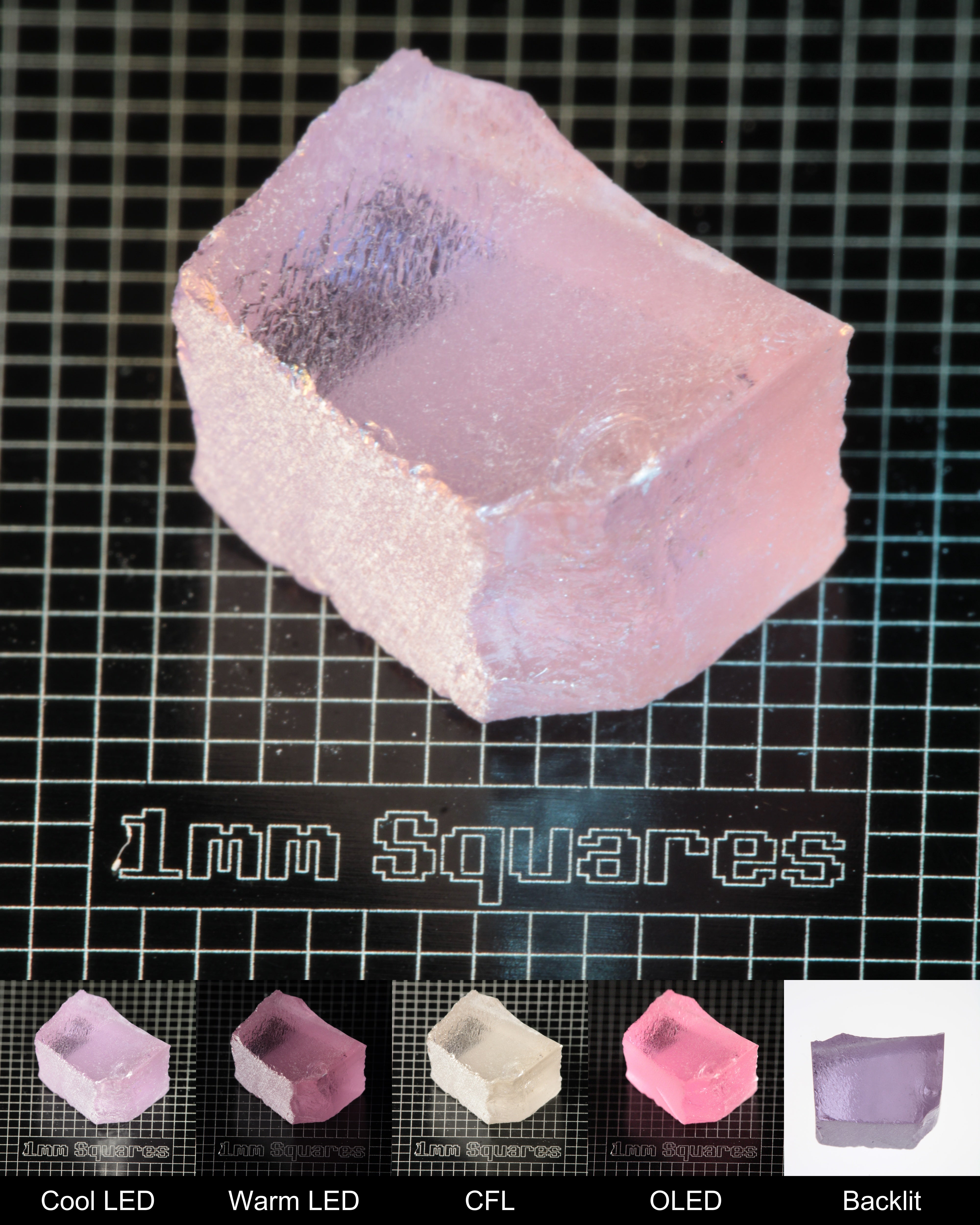 Nd:GGG Block Gem Rough Under Multiple Lights Showing the Color Change