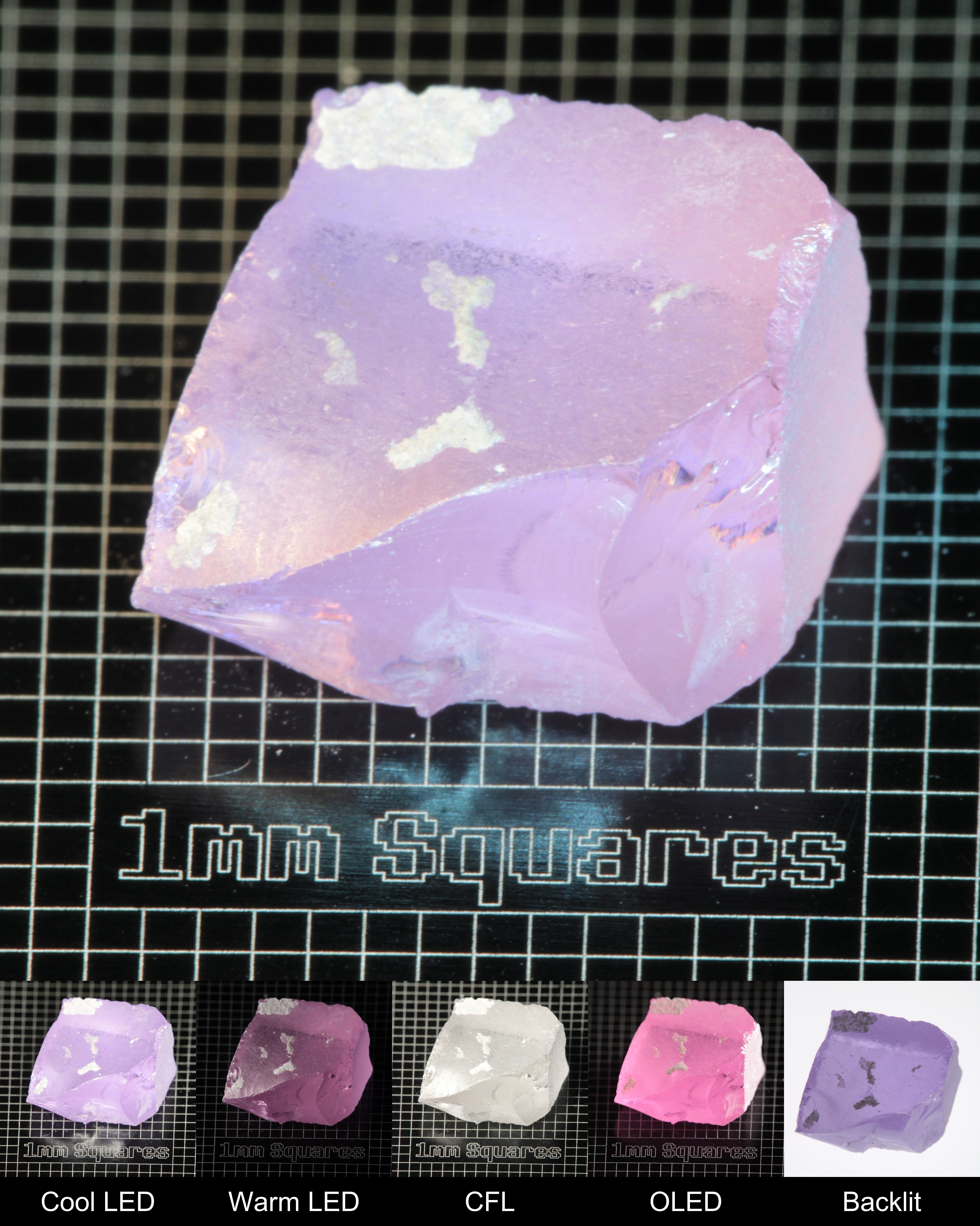 Nd:GGG Block Gem Rough Under Multiple Lights Showing the Color Change