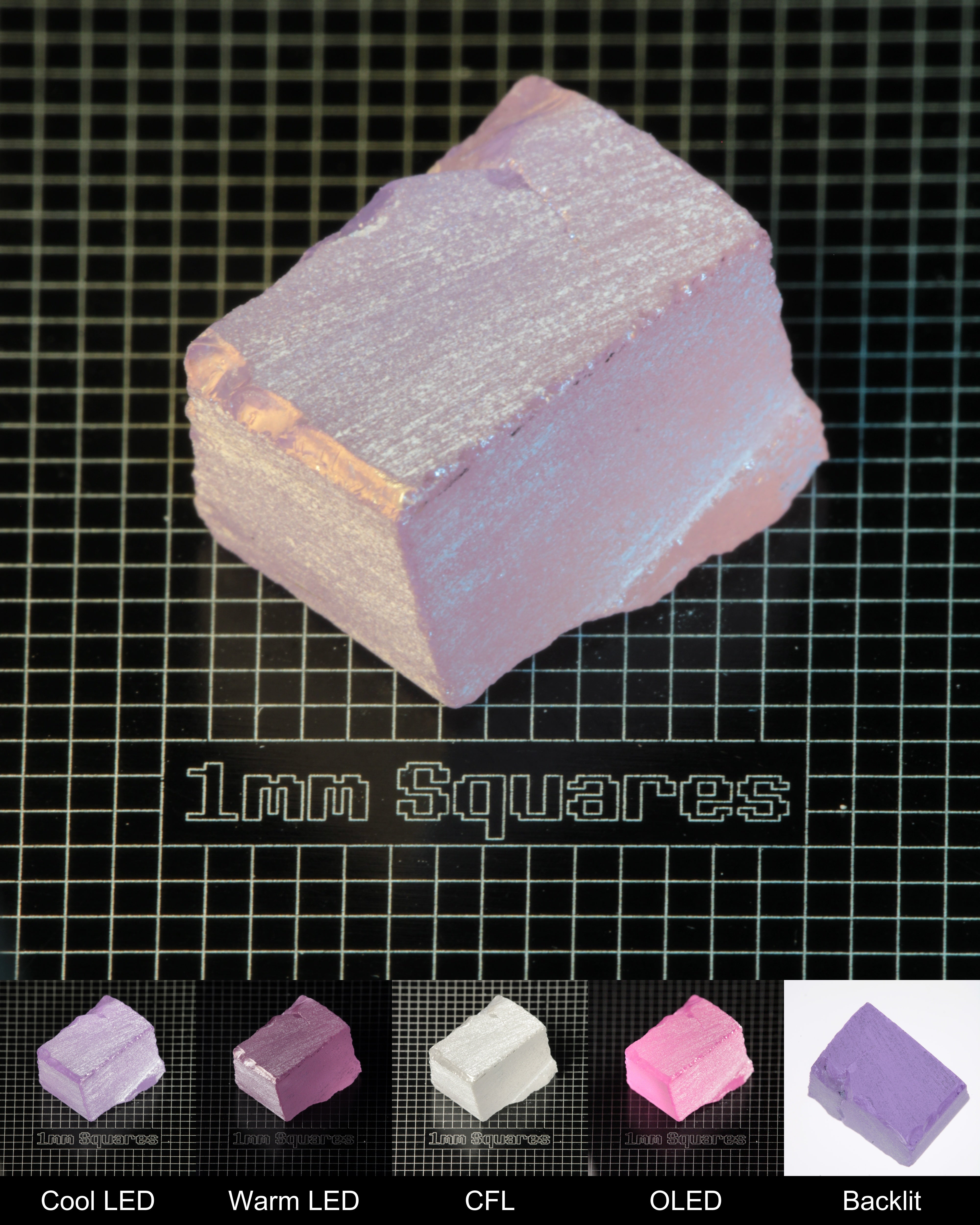 Nd:GGG Cracked Block Gem Rough Under Multiple Lights Showing the Color Change